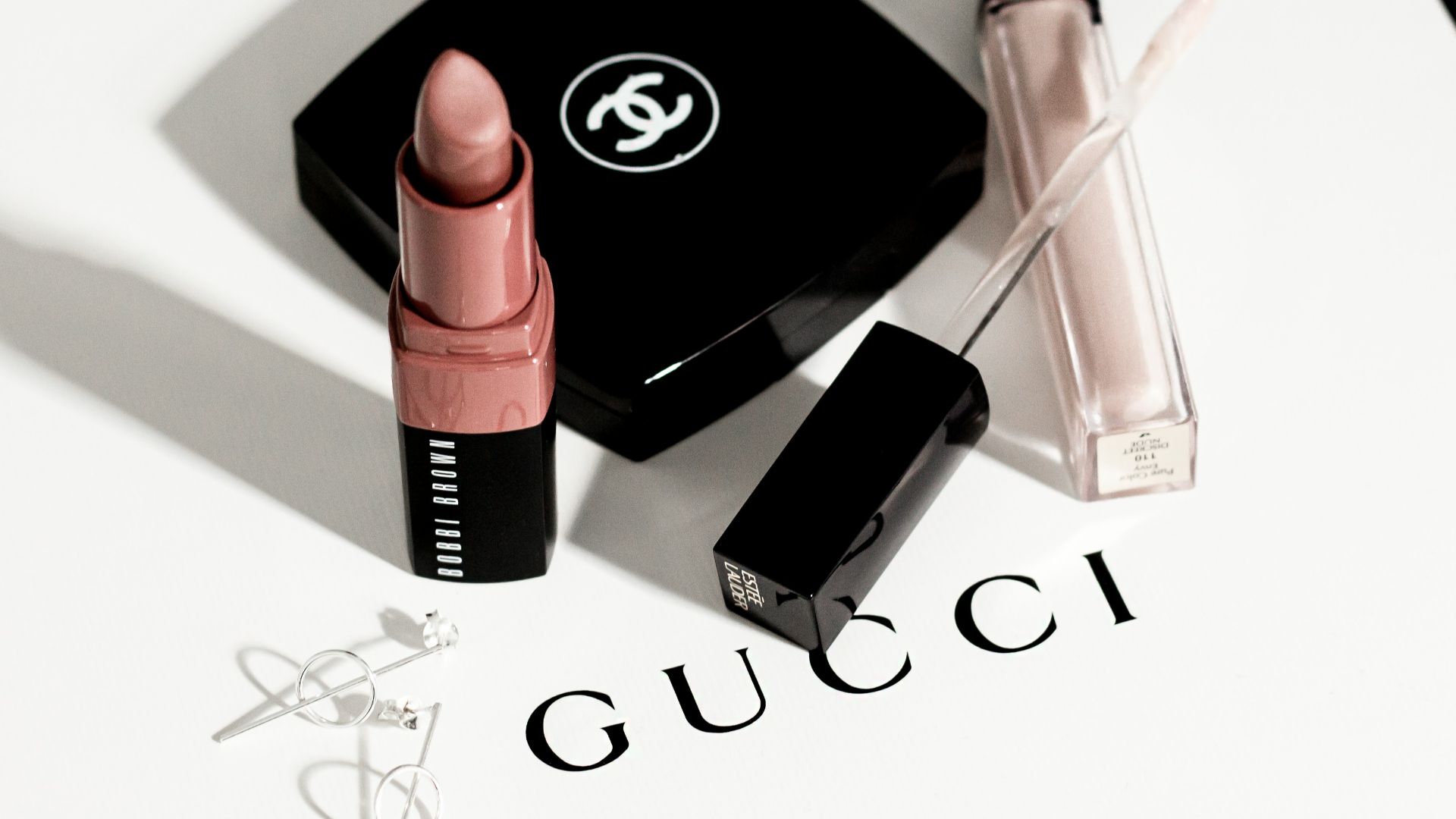 black and pink lipstick and black eyeshadow palette