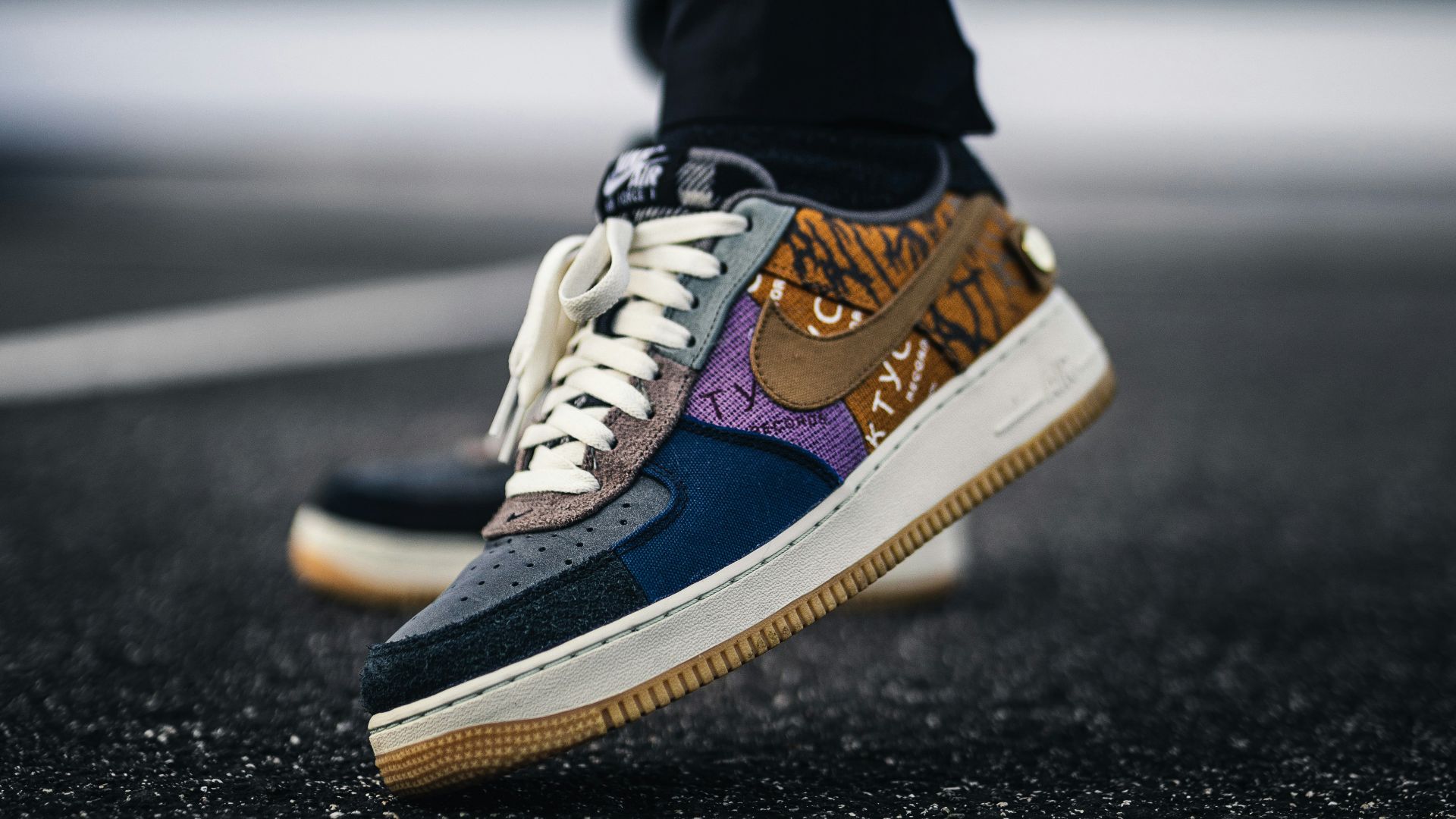 person in blue and white nike sneakers