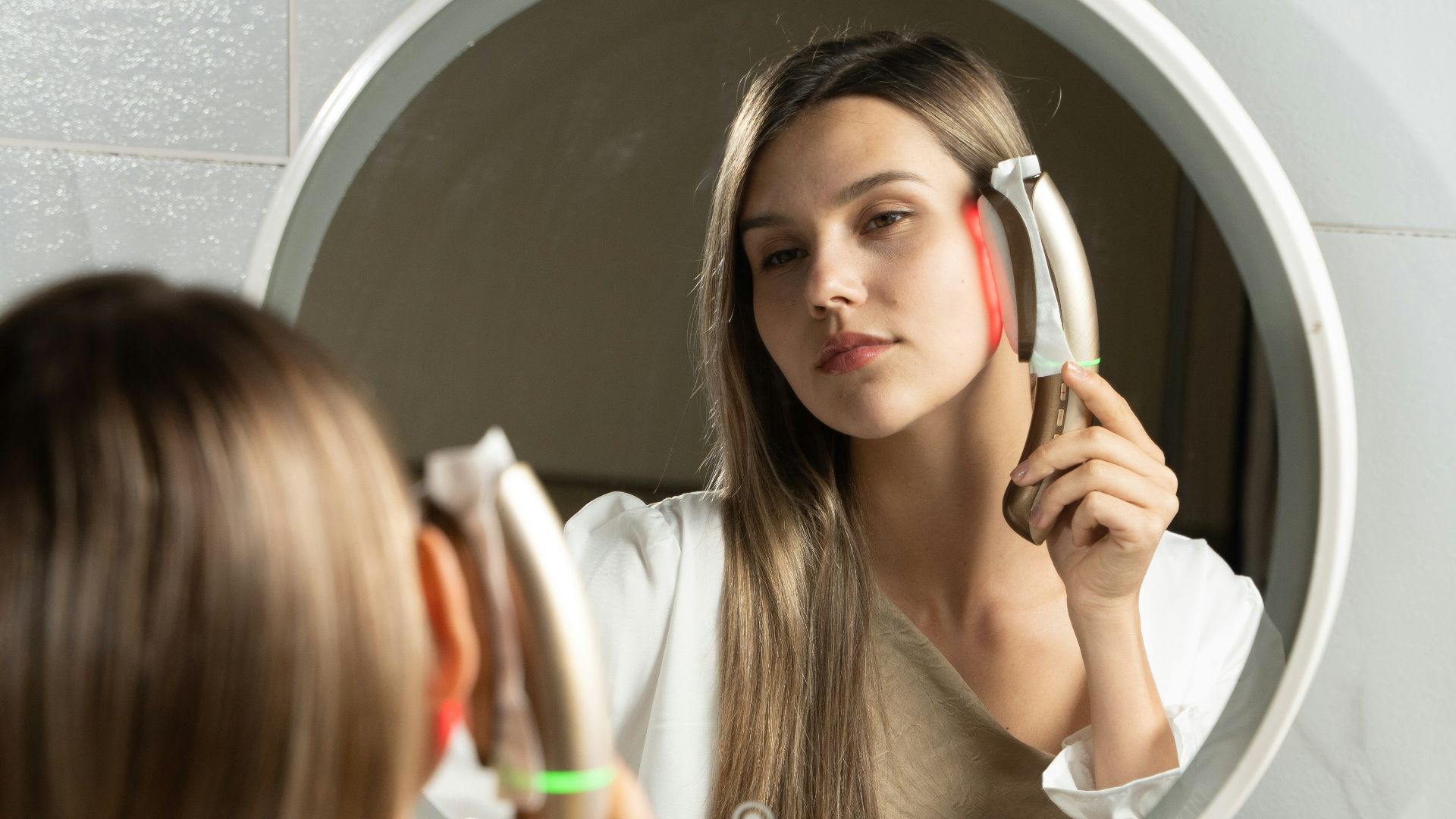 a woman brushing her teeth in front of a mirror