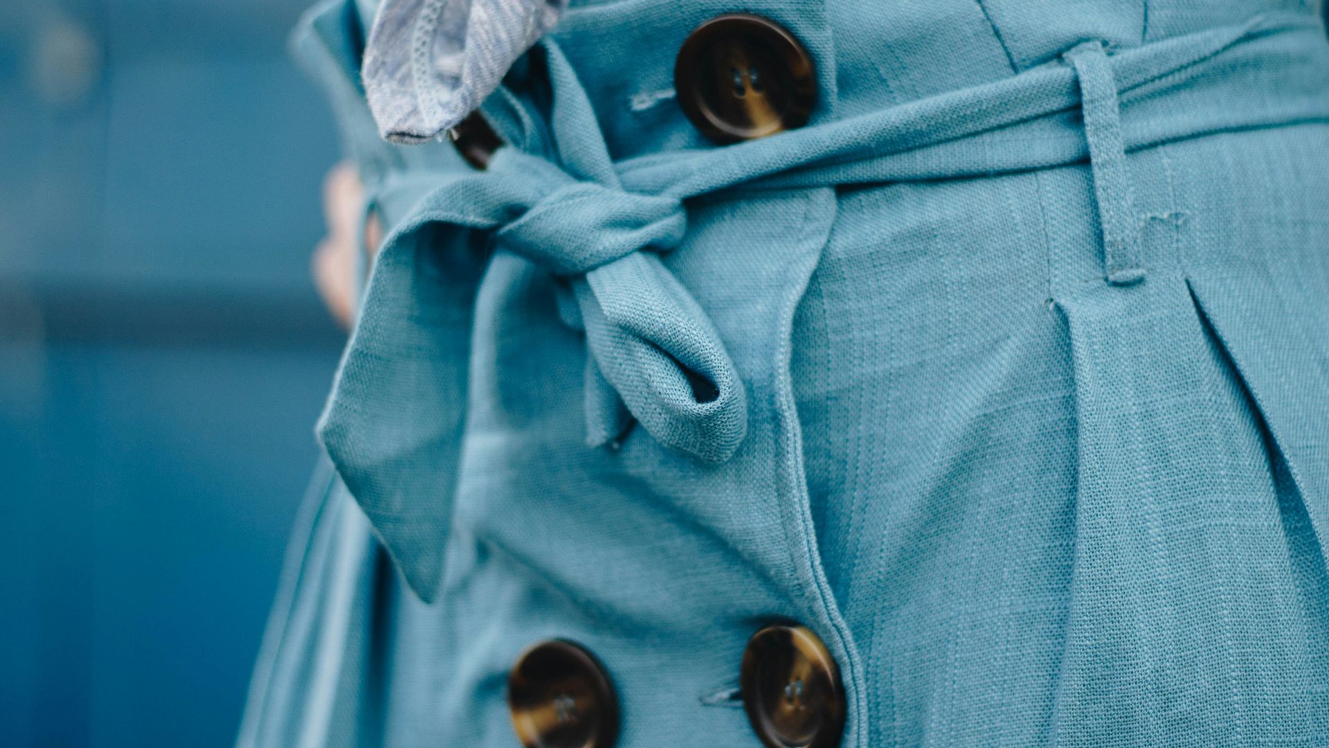 close-up photo of blue apparel during daytime
