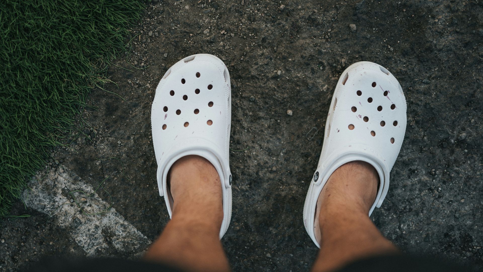 person wearing white rubber clog