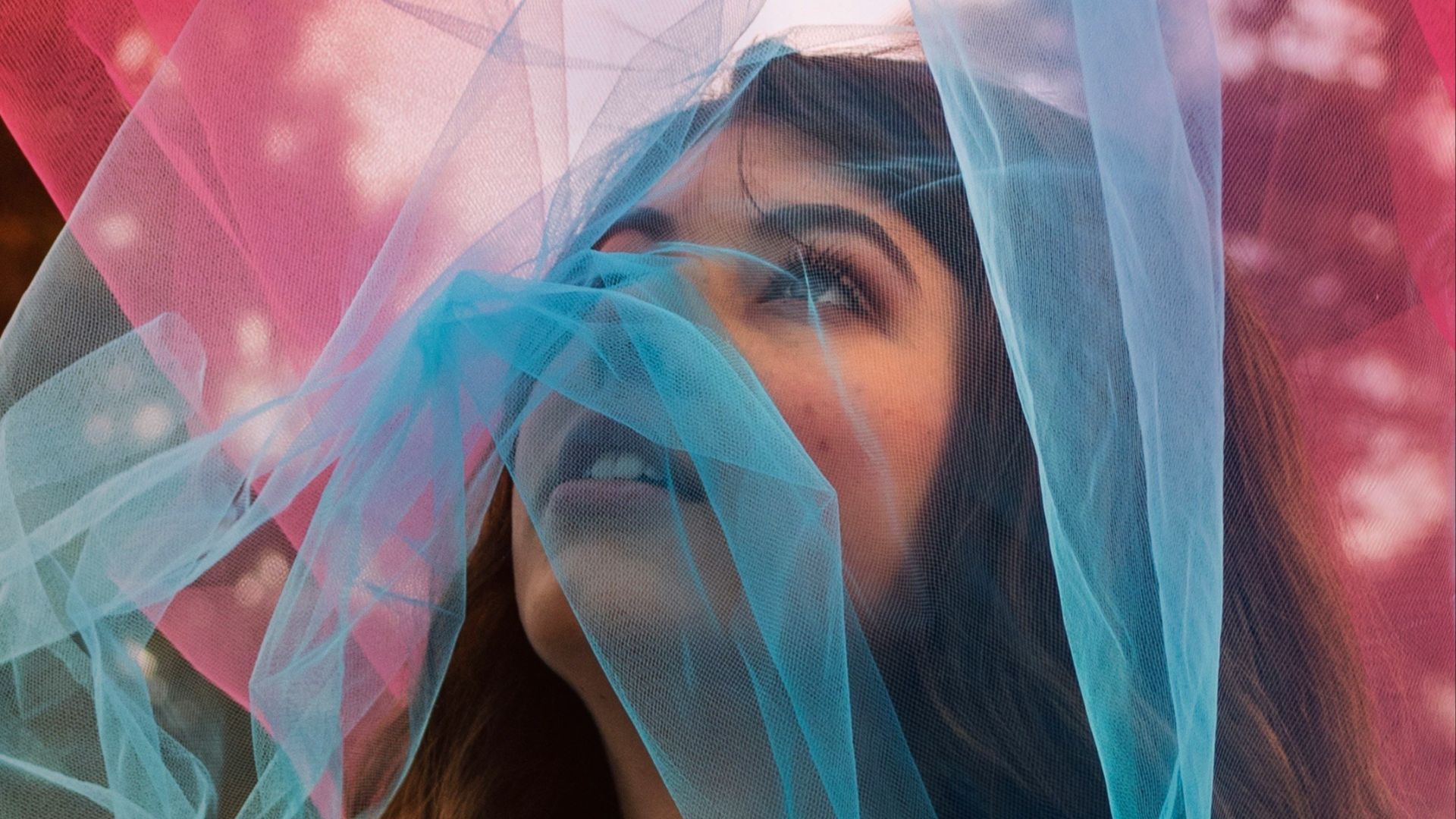 woman in white and pink floral hijab