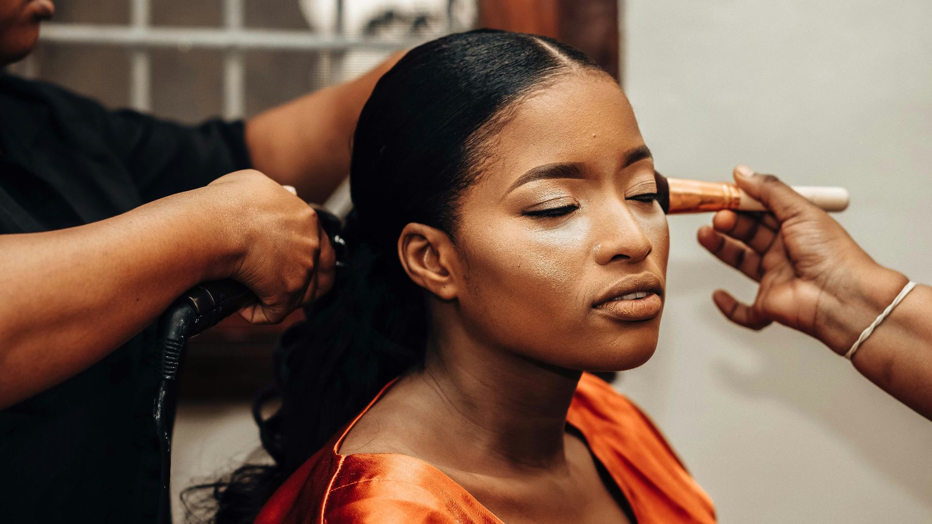 a woman getting her hair done