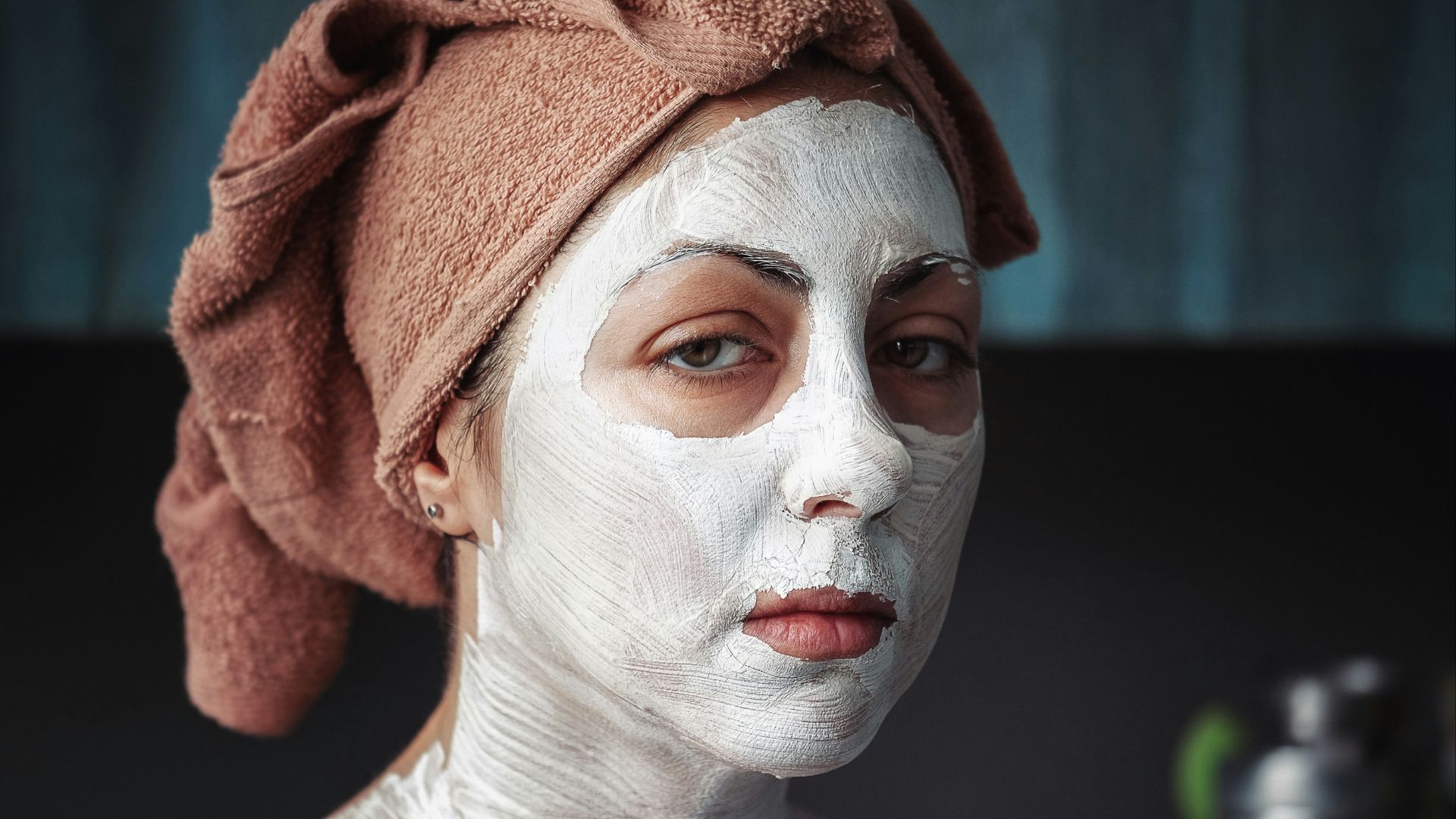 shallow focus photography of woman having a facial