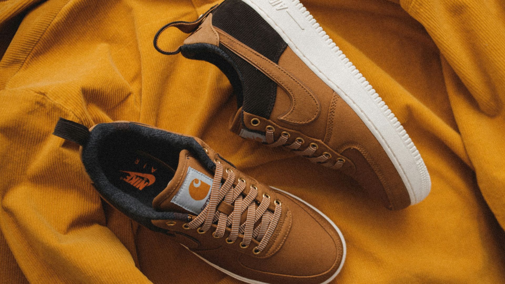 pair of Carhartt x Nike Air Force 1 shoes