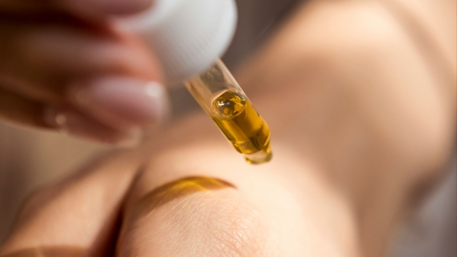 person holding dropper