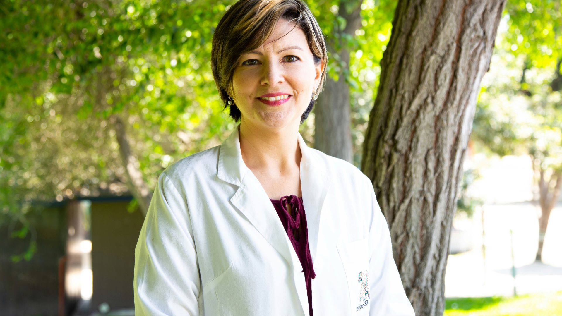 woman standing under tree