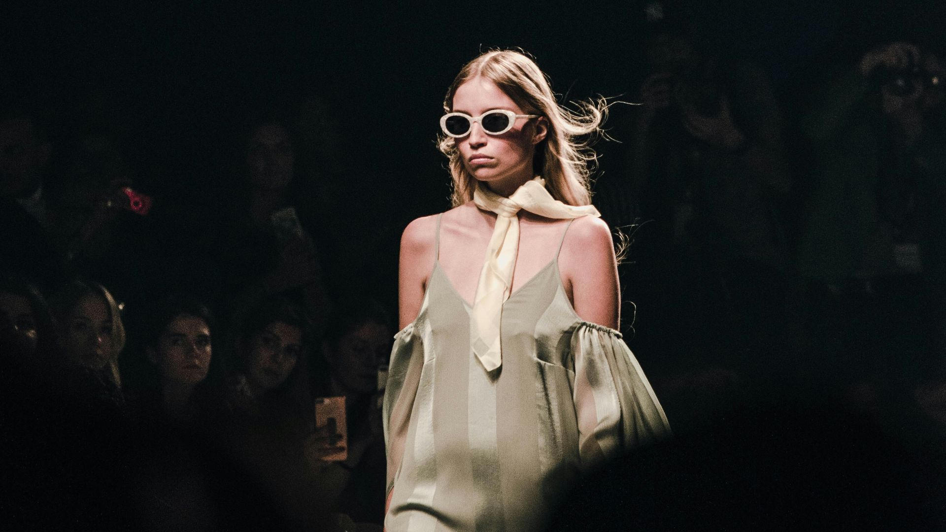 woman in white dress wearing sunglasses