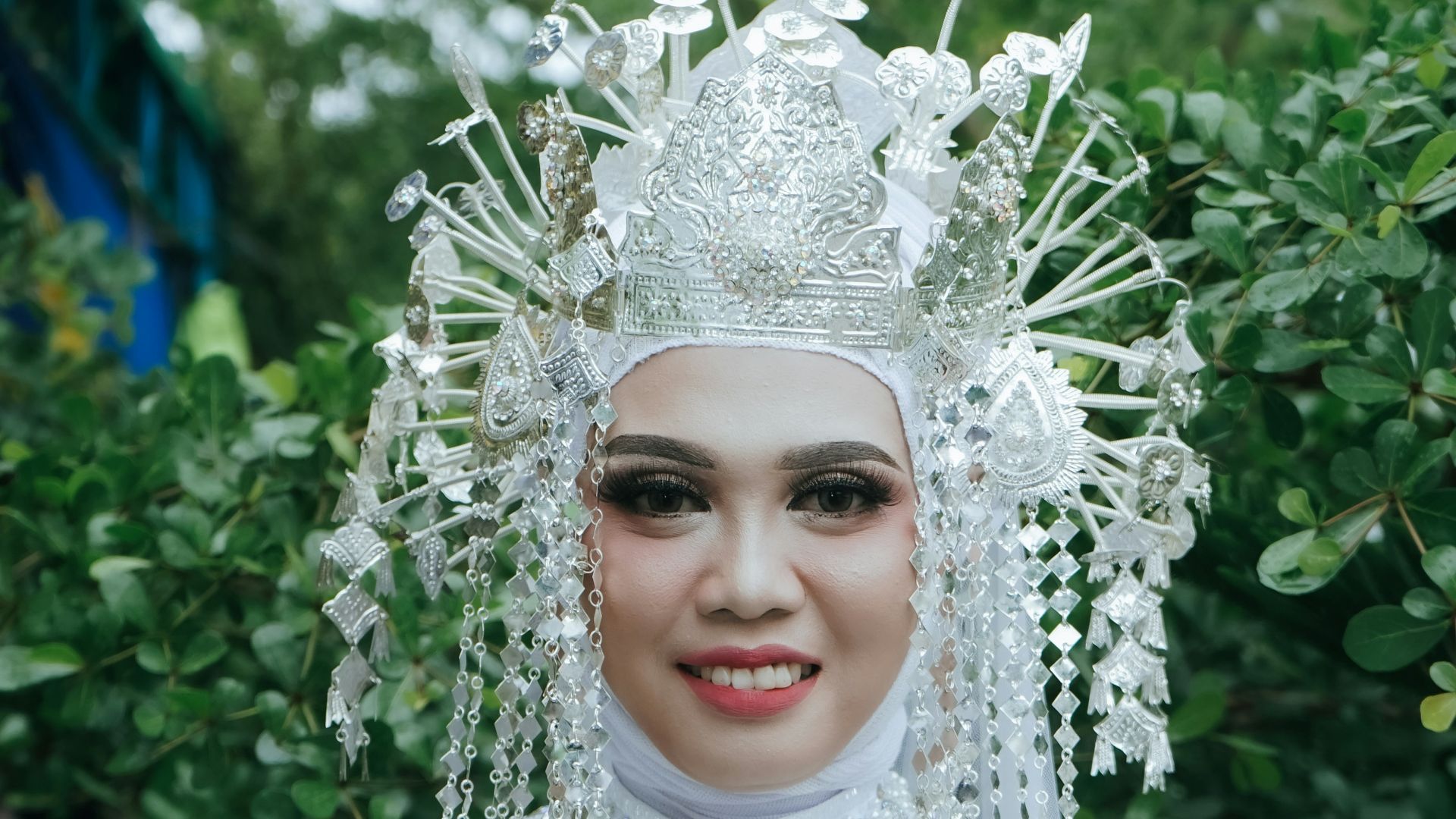 a woman in a white dress and headdress