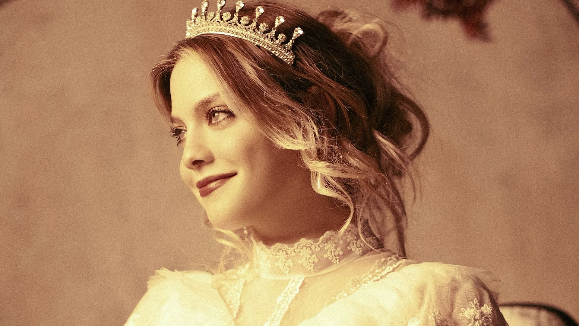 a woman sitting in a chair holding a bouquet of flowers