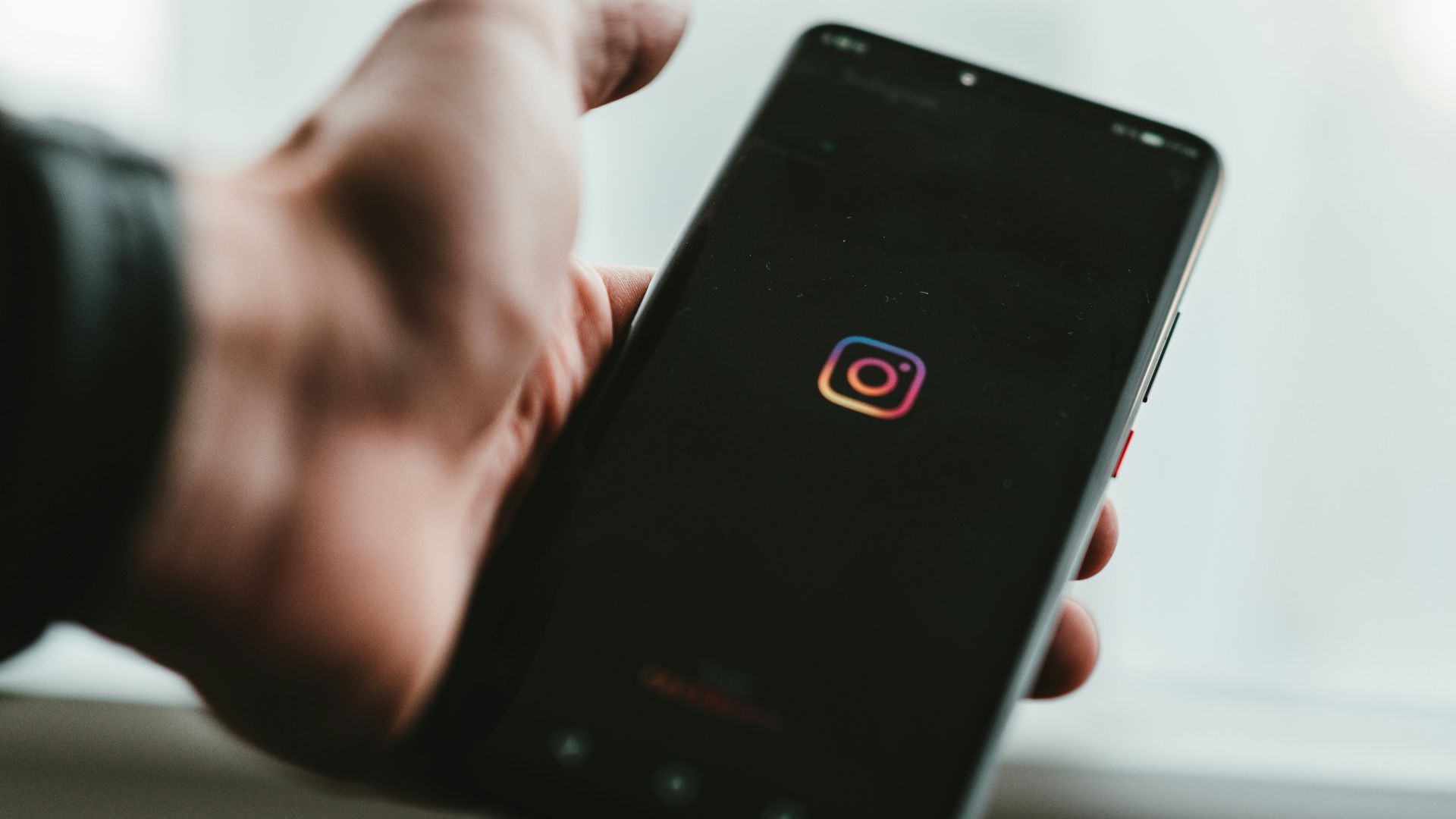 person holding black android smartphone