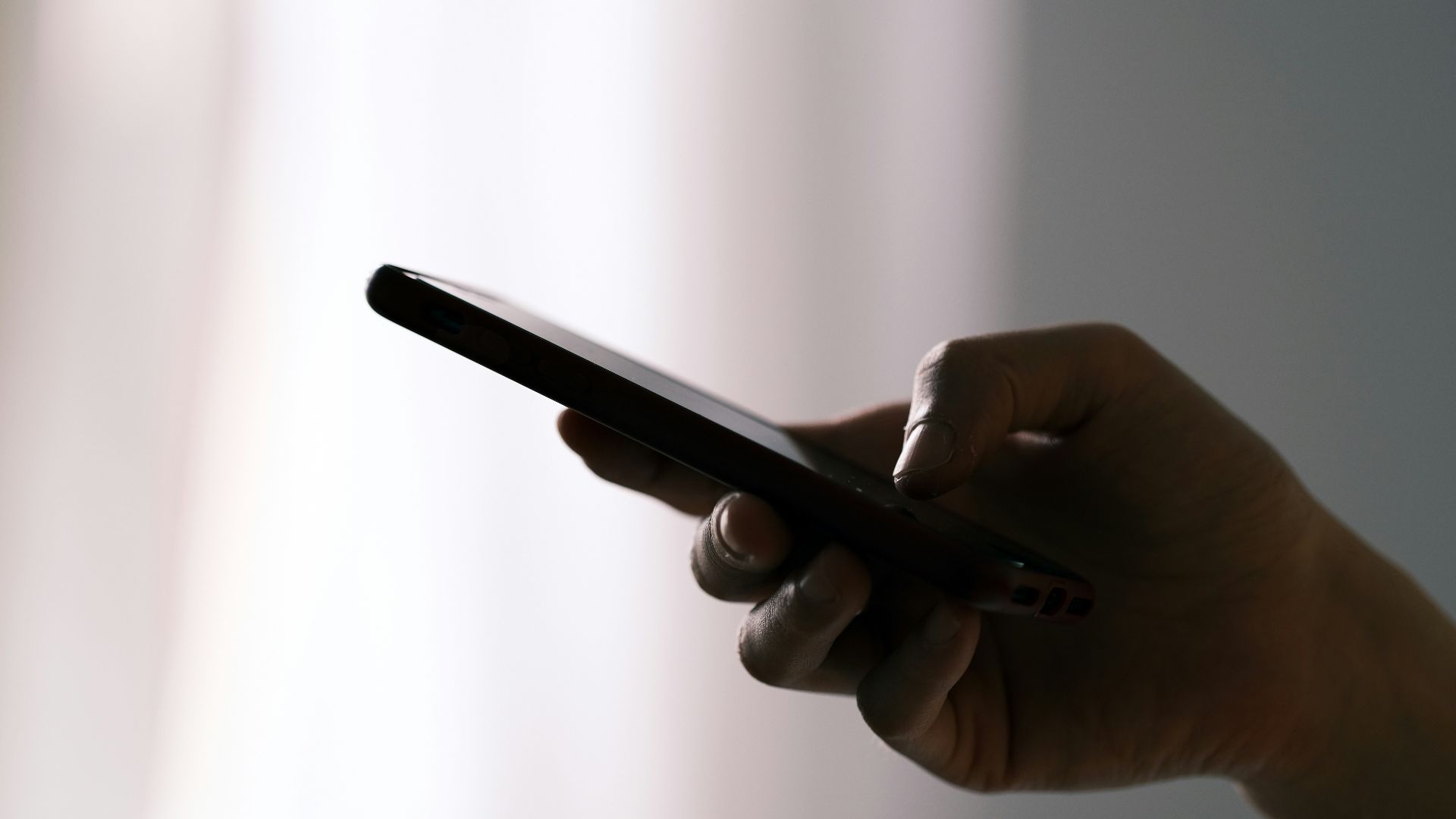 person holding black android smartphone