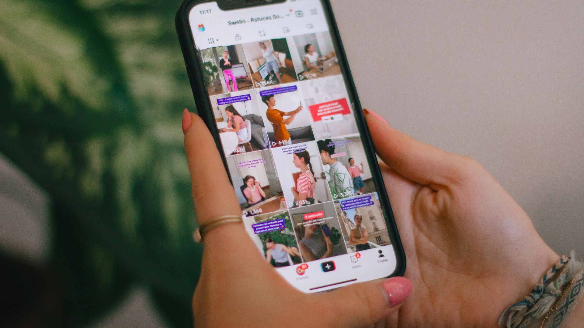 A person holding a cell phone in their hand