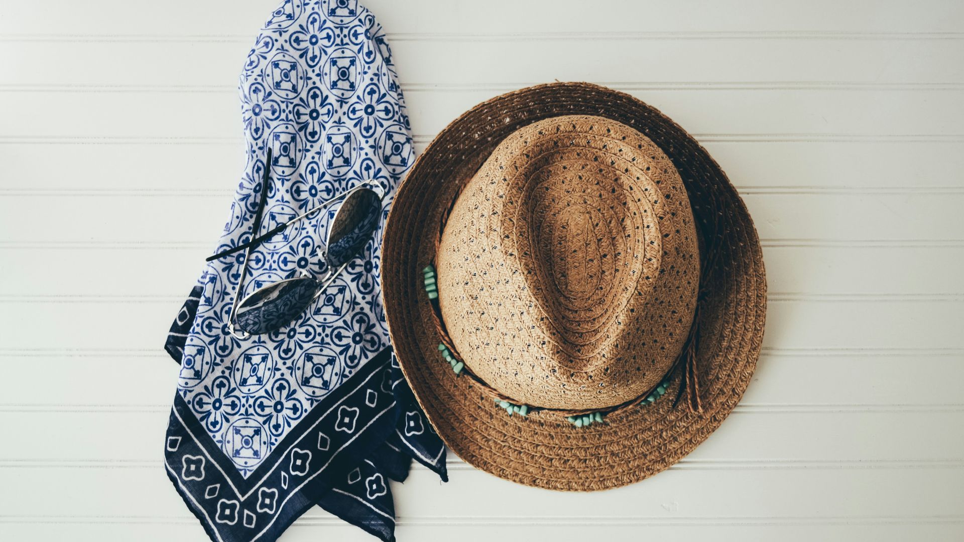 brown hat beside black handkerchief