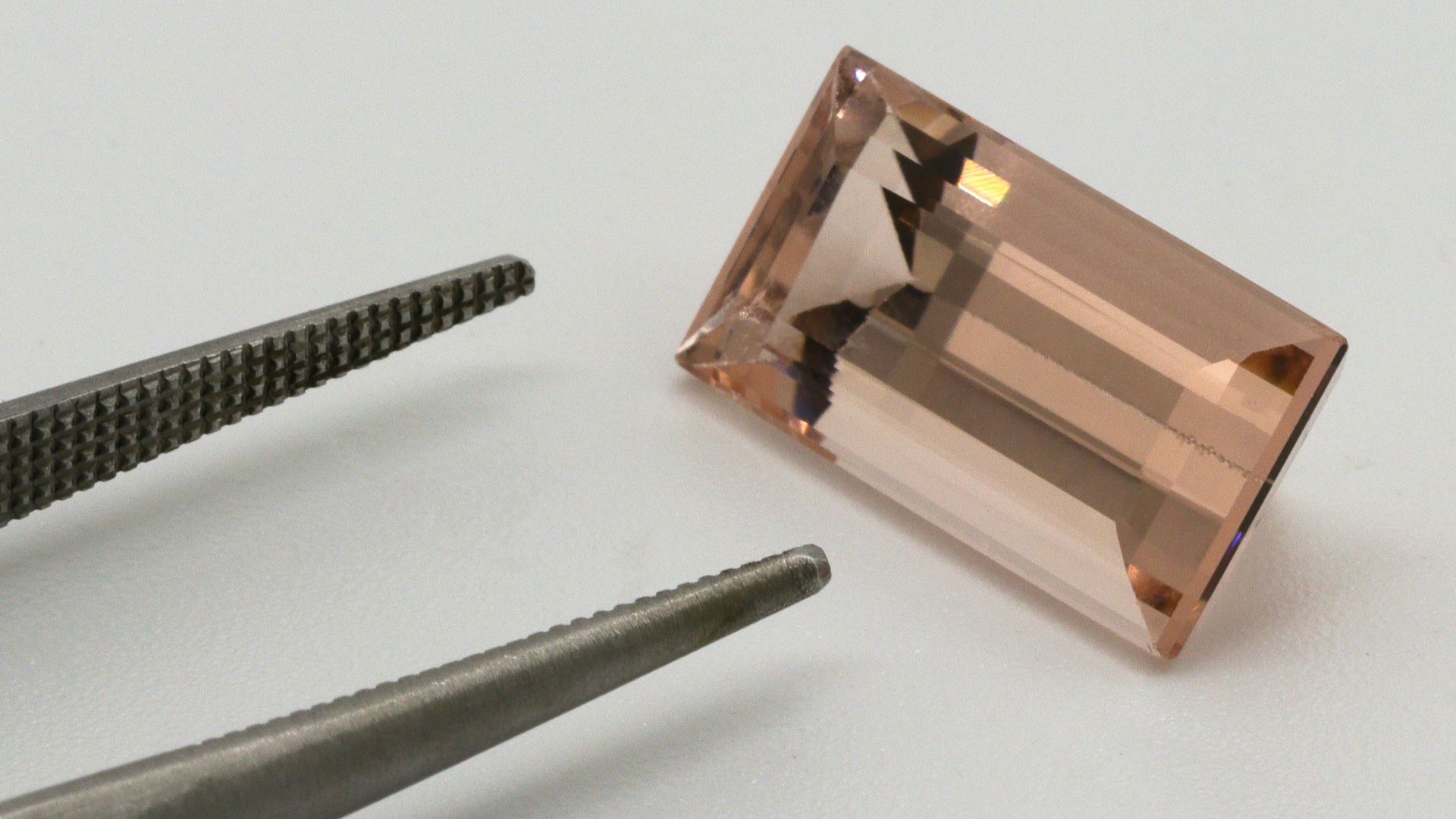 silver nail cutter on white table