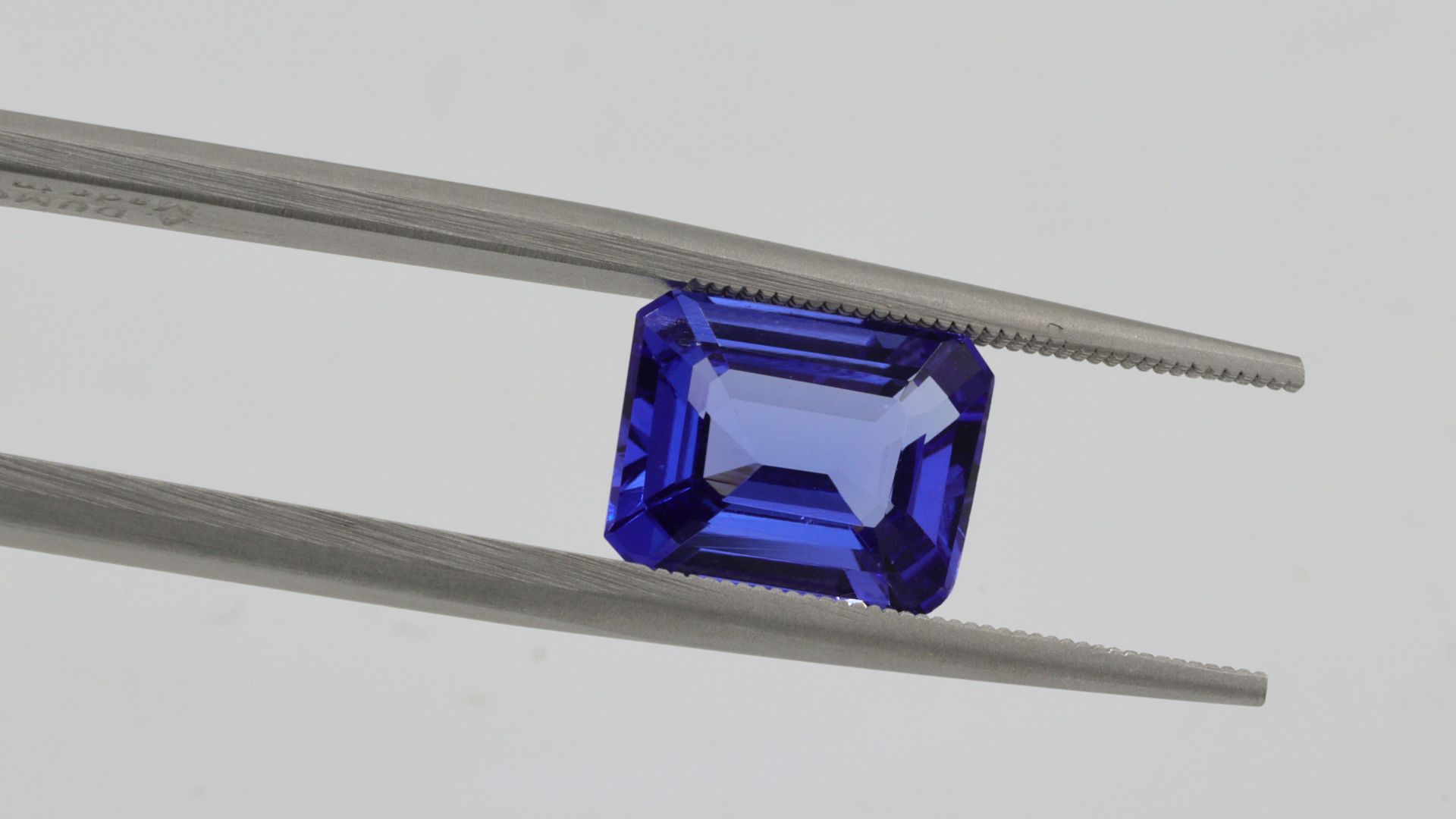 blue plastic container on white surface