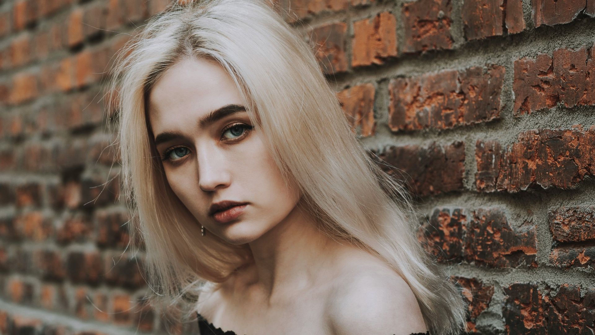 woman in black off shoulder dress