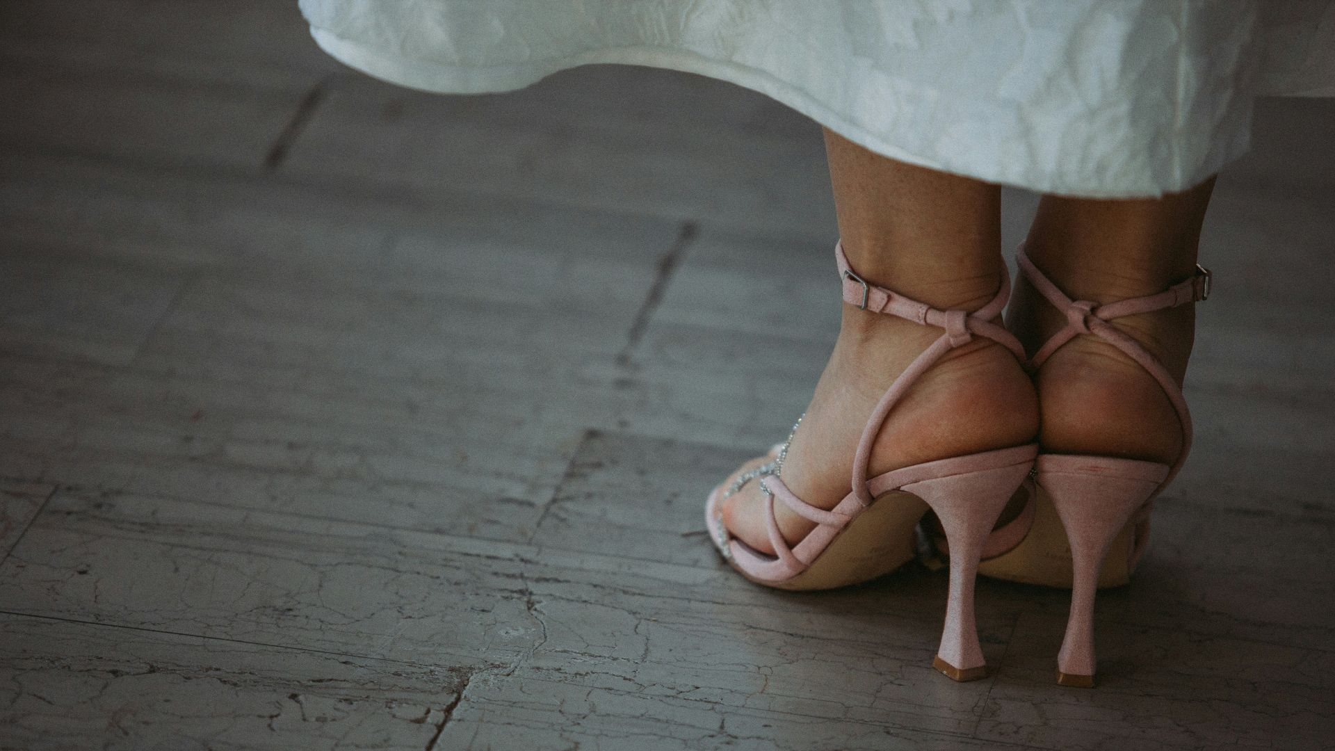 a close up of a person wearing high heels
