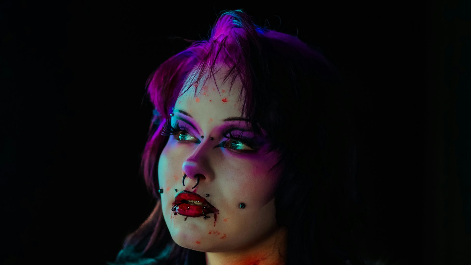 Woman with gothic makeup and dark clothing