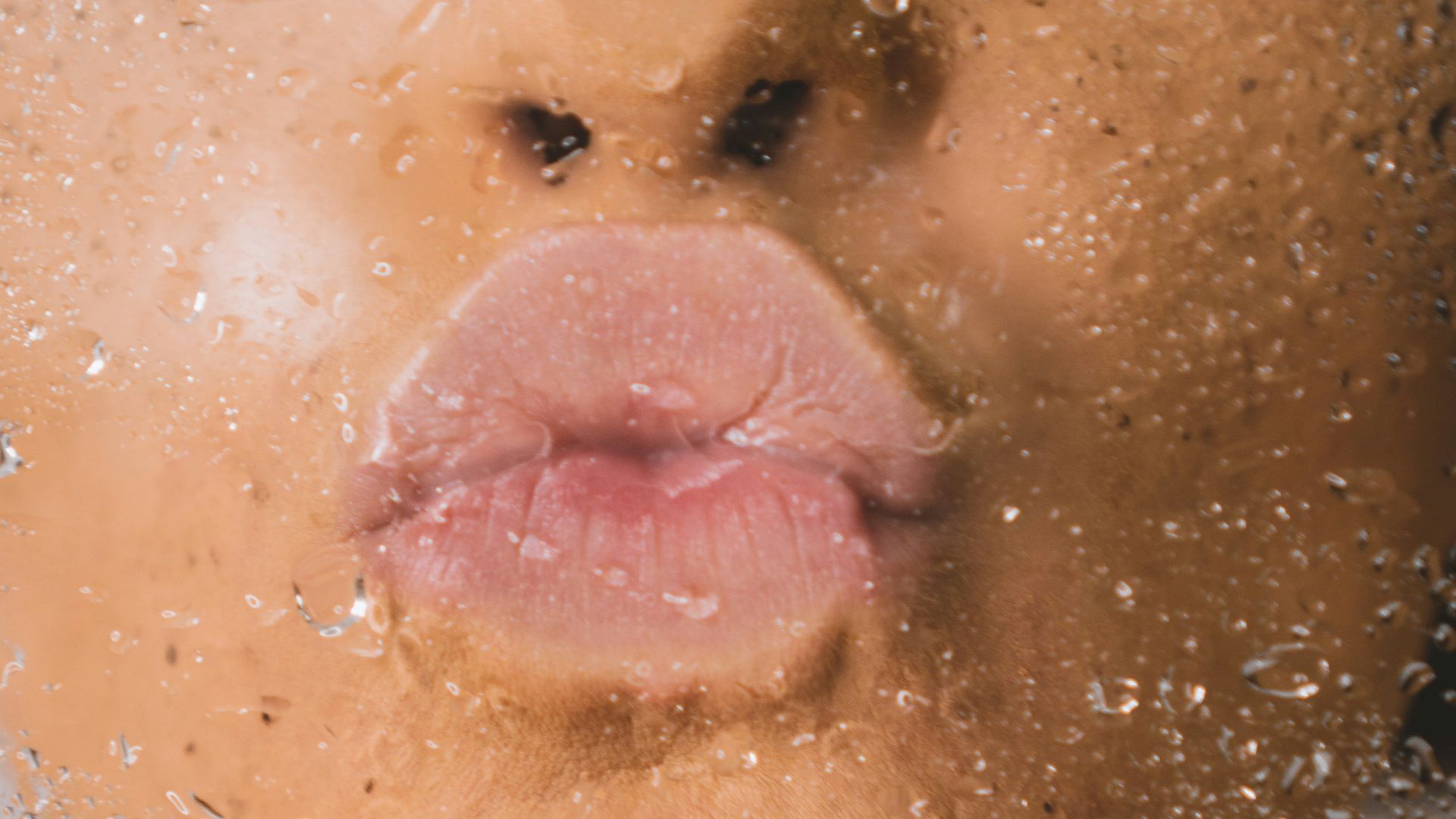 woman in water with water droplets