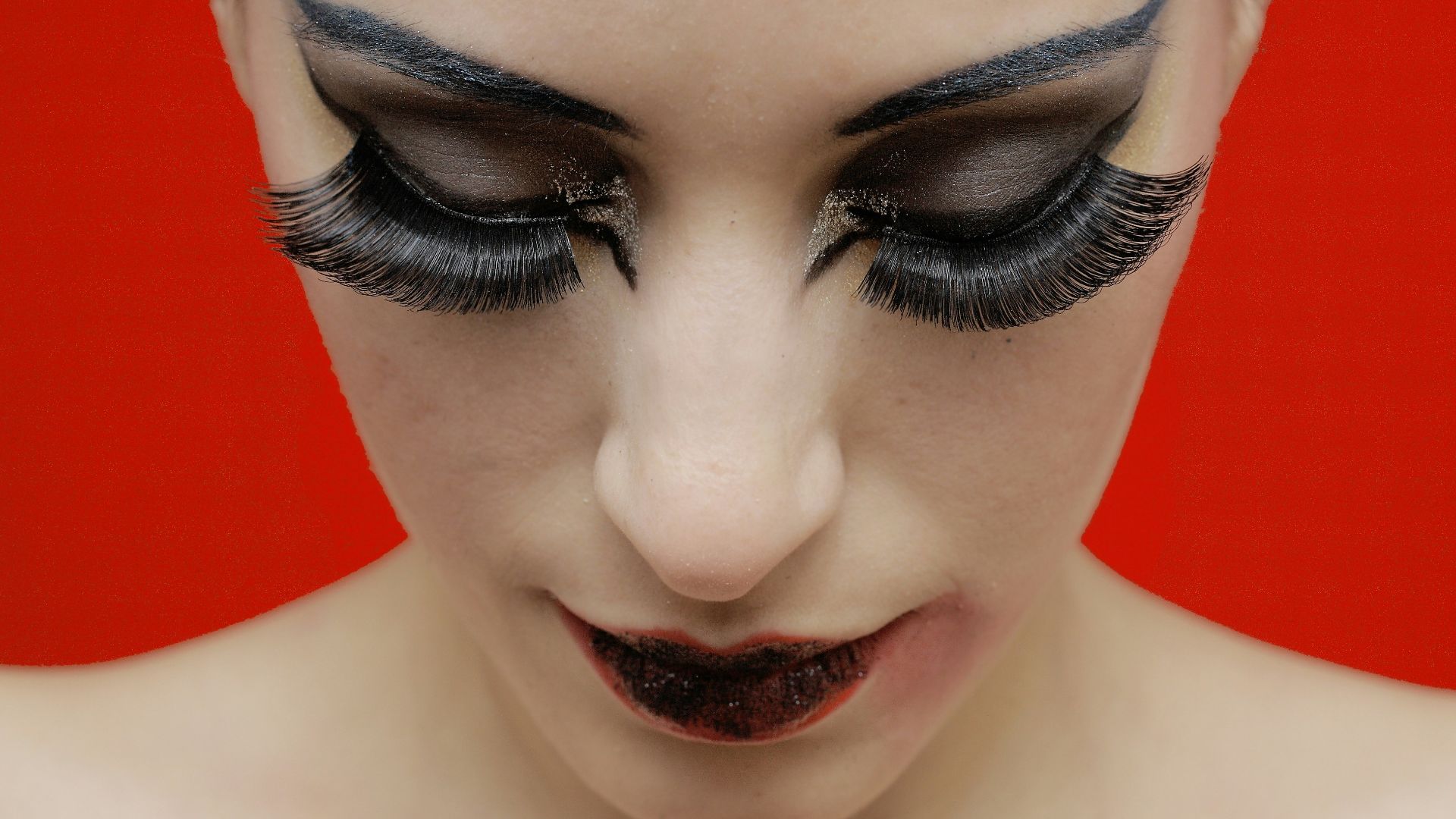 woman with black lipstick and red lipstick