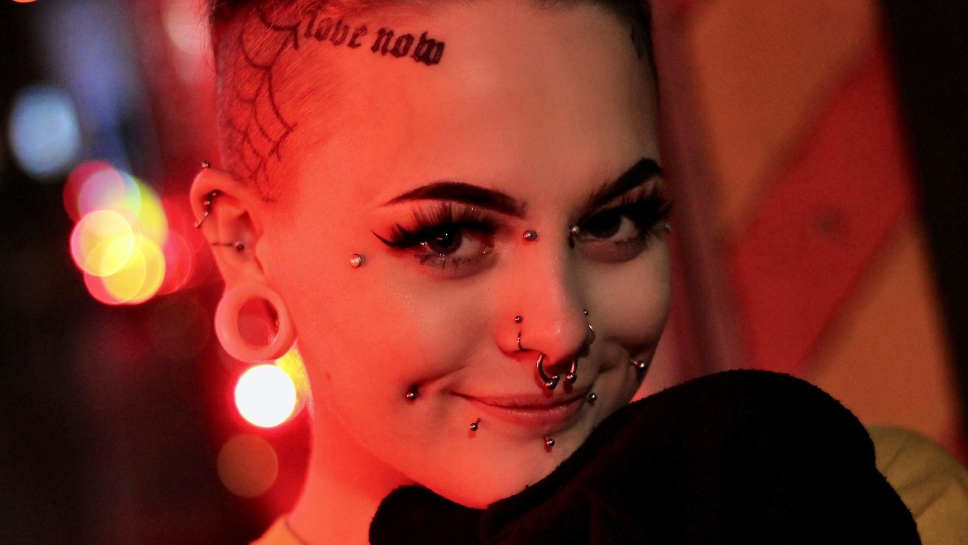 grayscale photo of smiling woman wearing beige crew-neck shirt