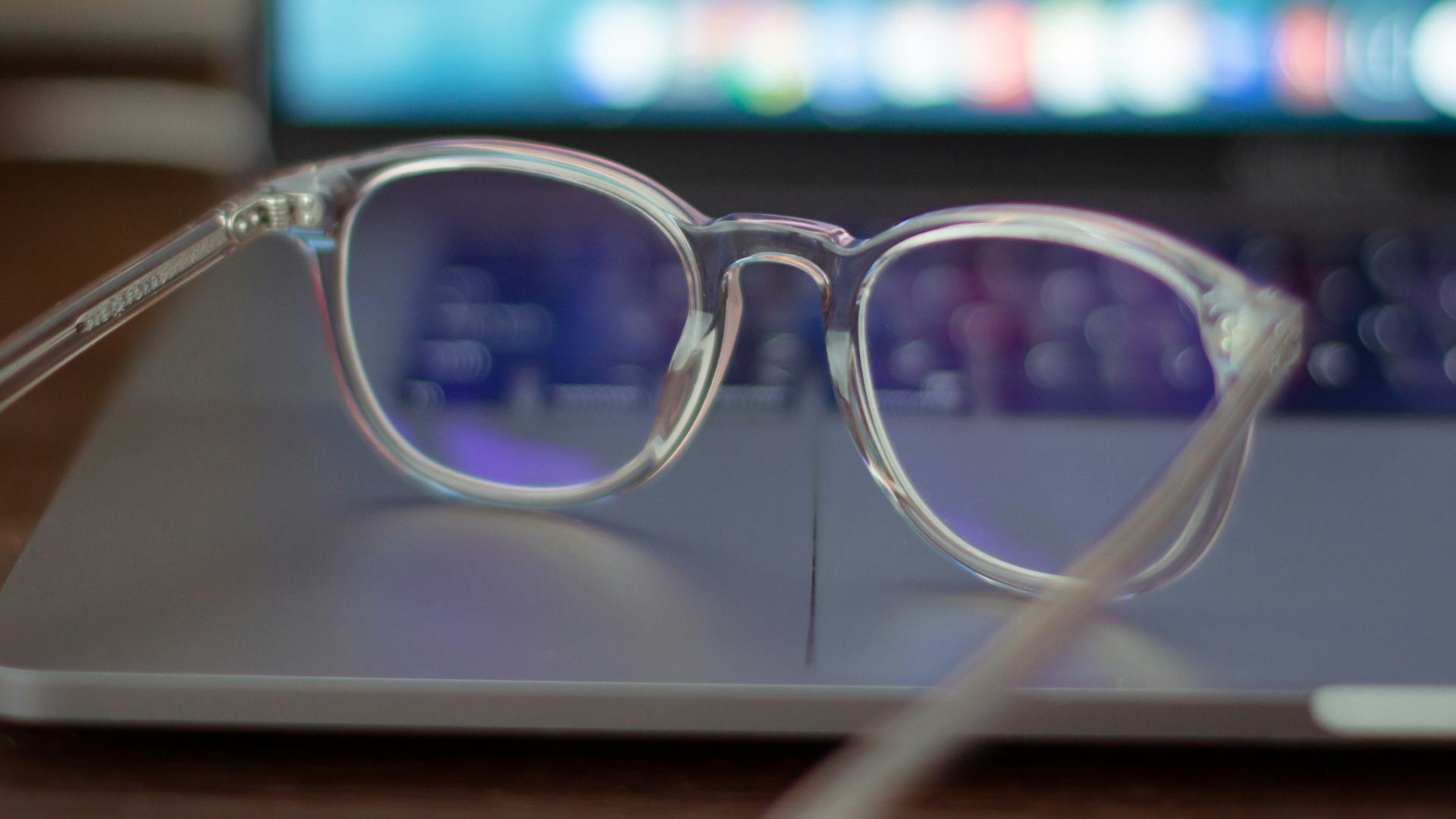 silver framed eyeglasses on white table
