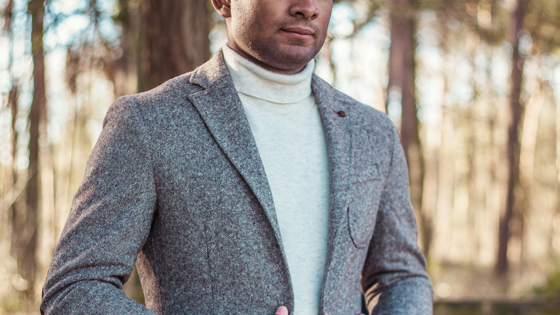 person holding gray coat