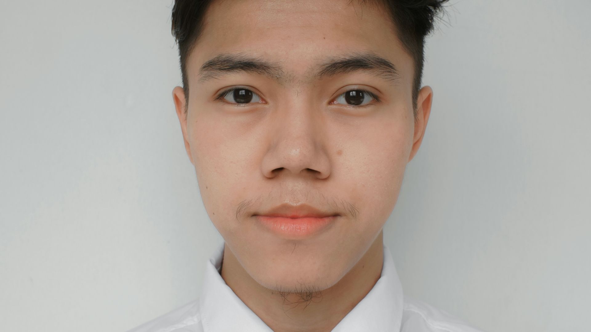 a man wearing a white shirt and a tie