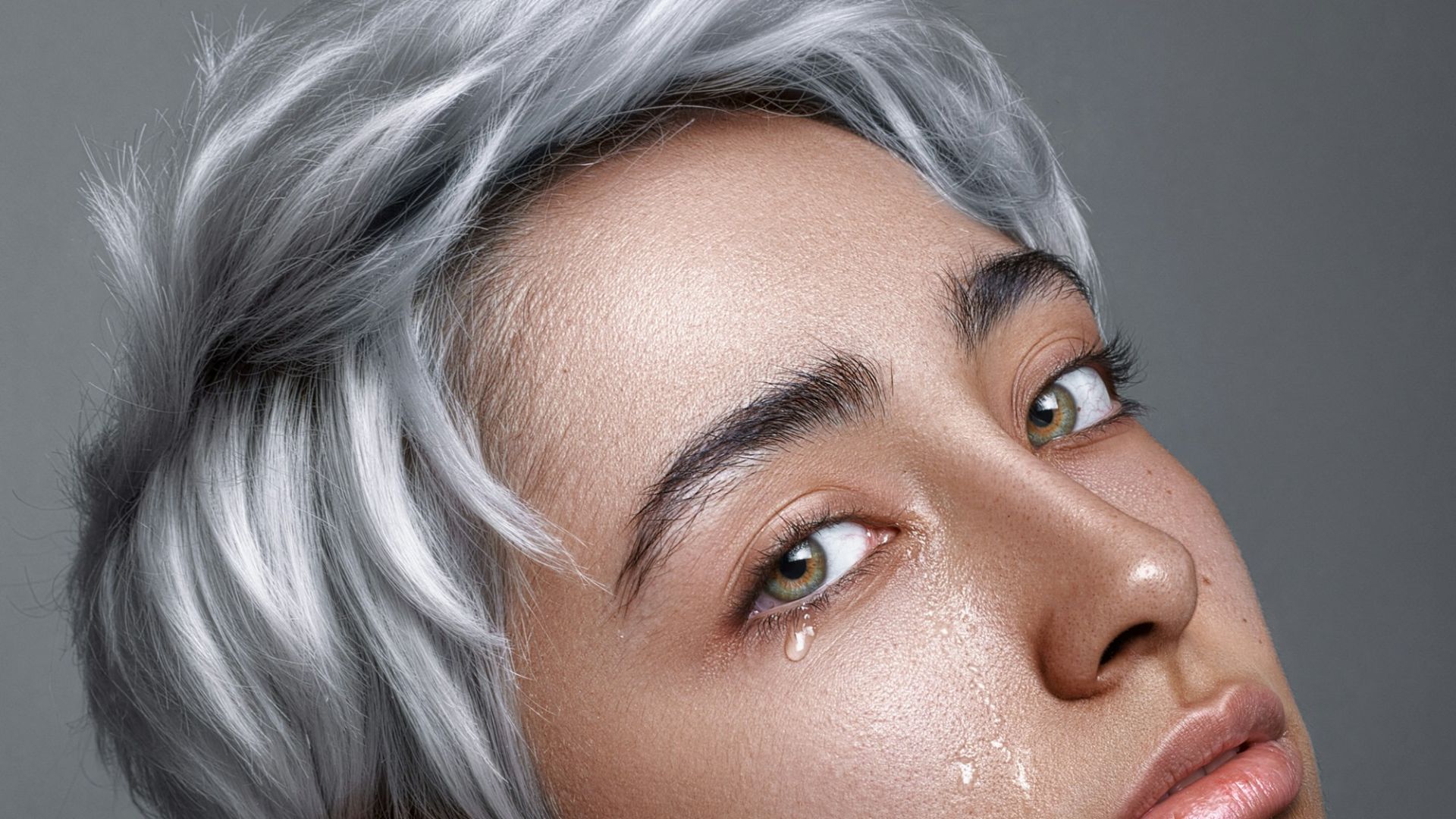 a woman with white hair and grey hair