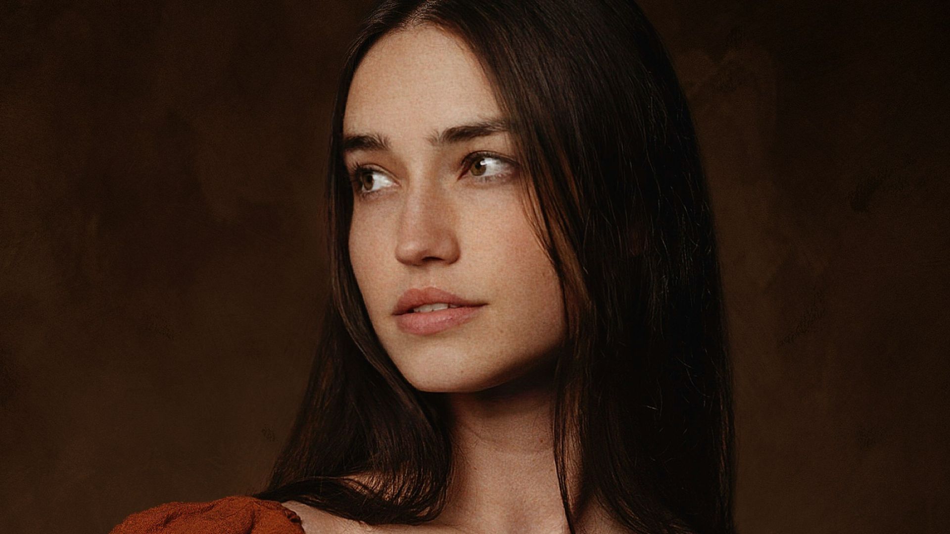 a woman in a red dress posing for a picture