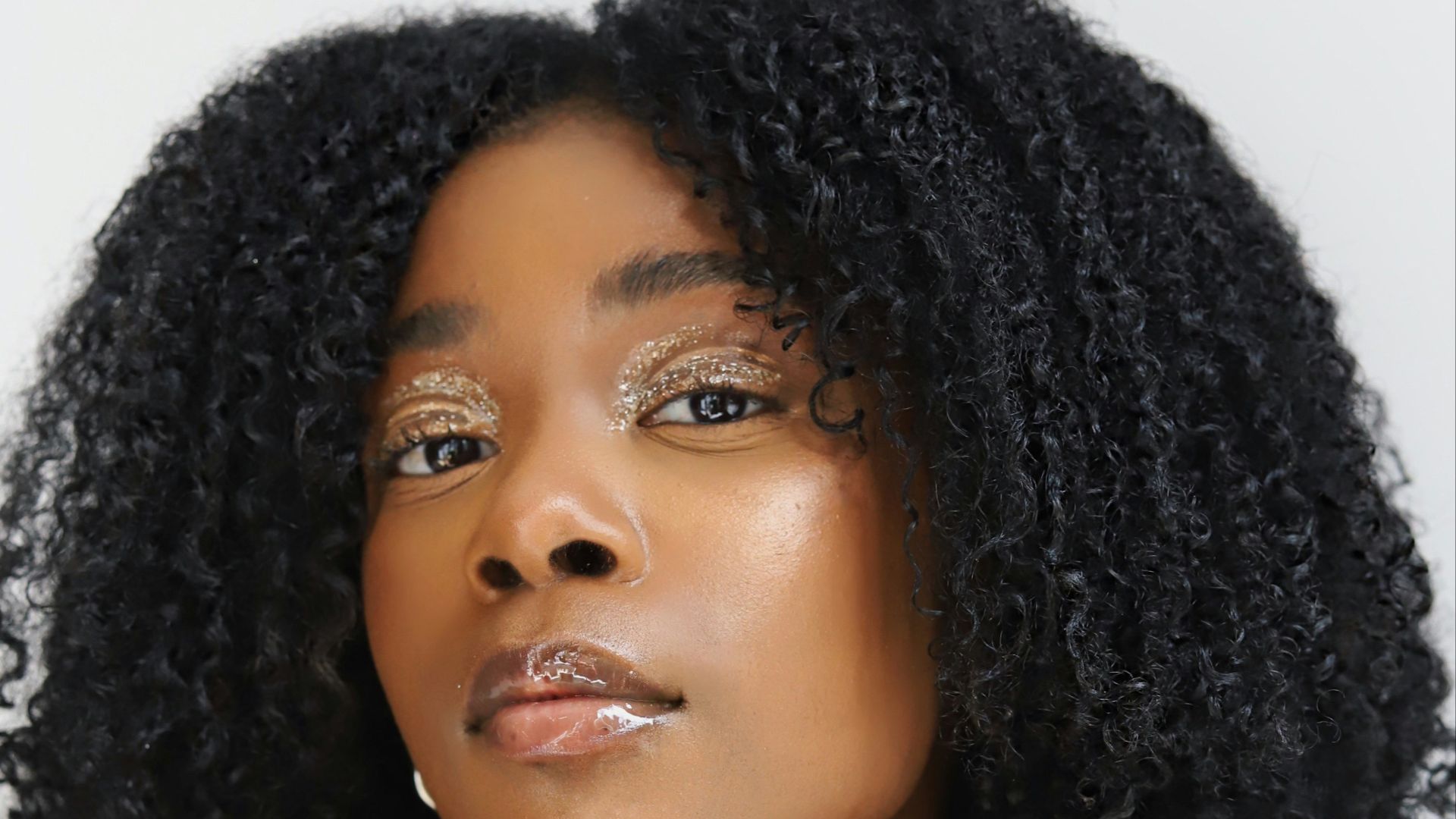 a woman with curly hair