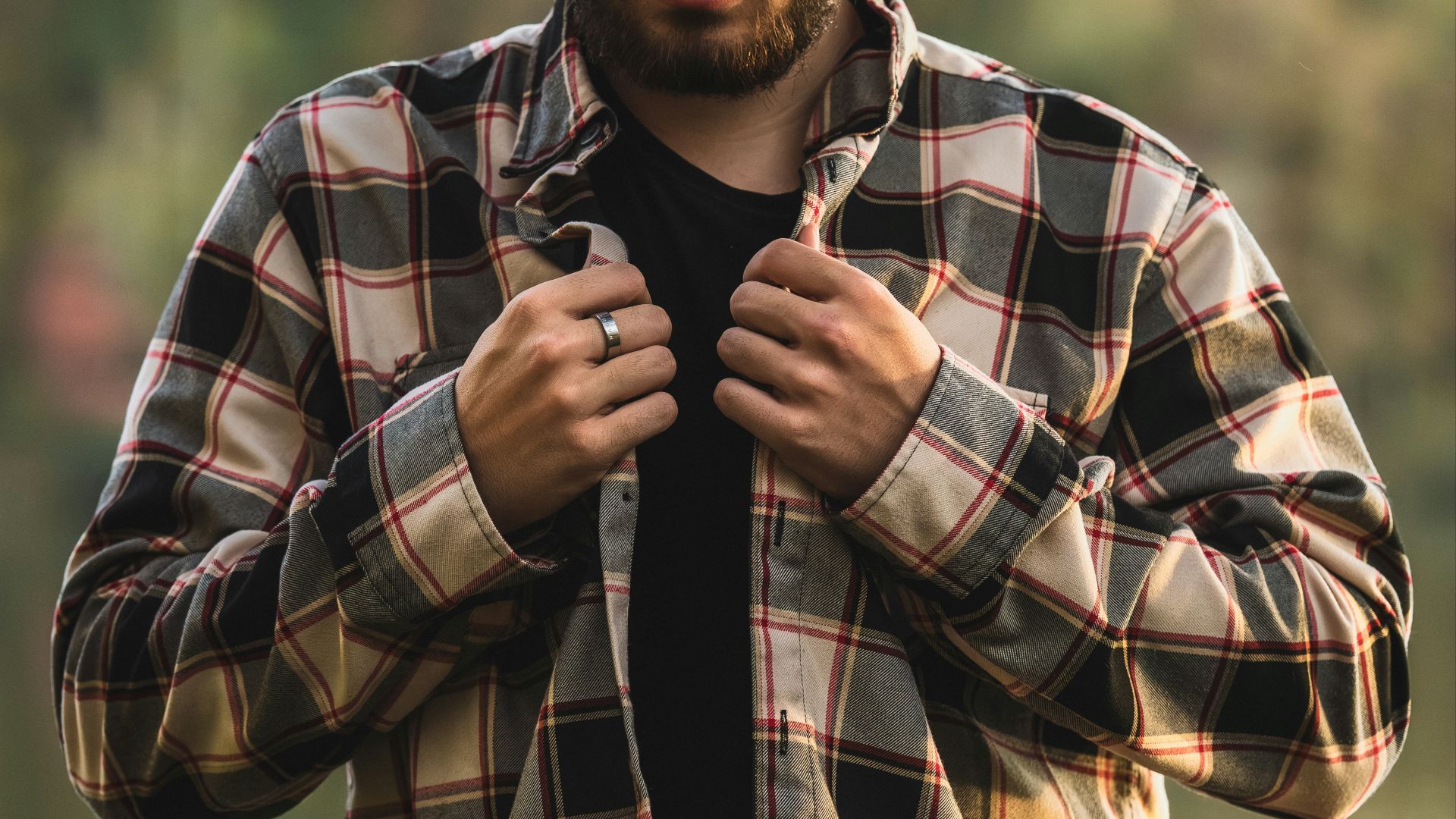 a man with a beard and a black shirt