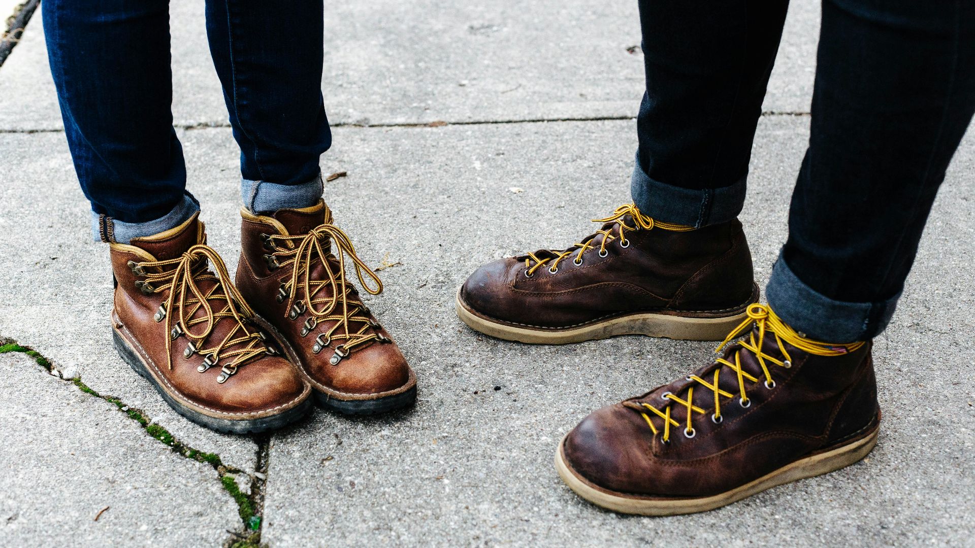 two person wearing brown leather boots