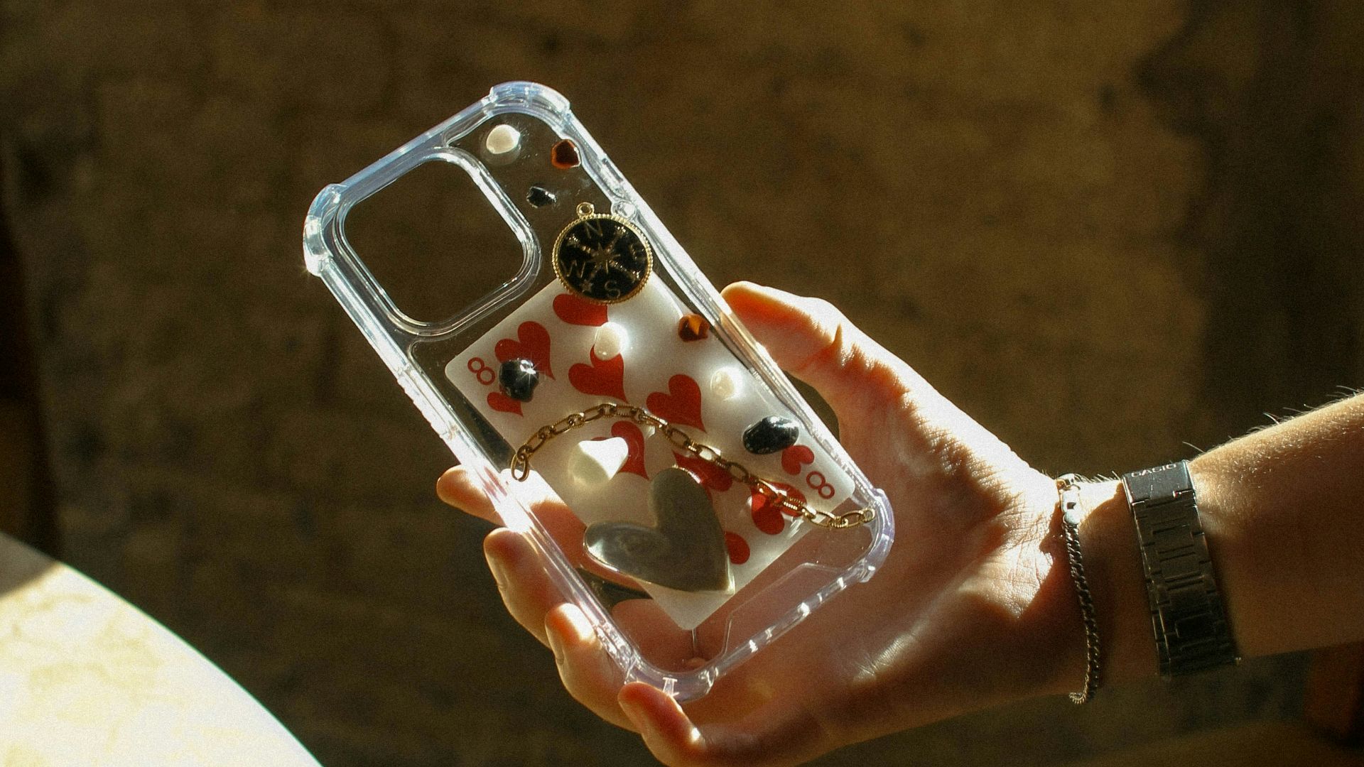 A person holding a cell phone in their hand