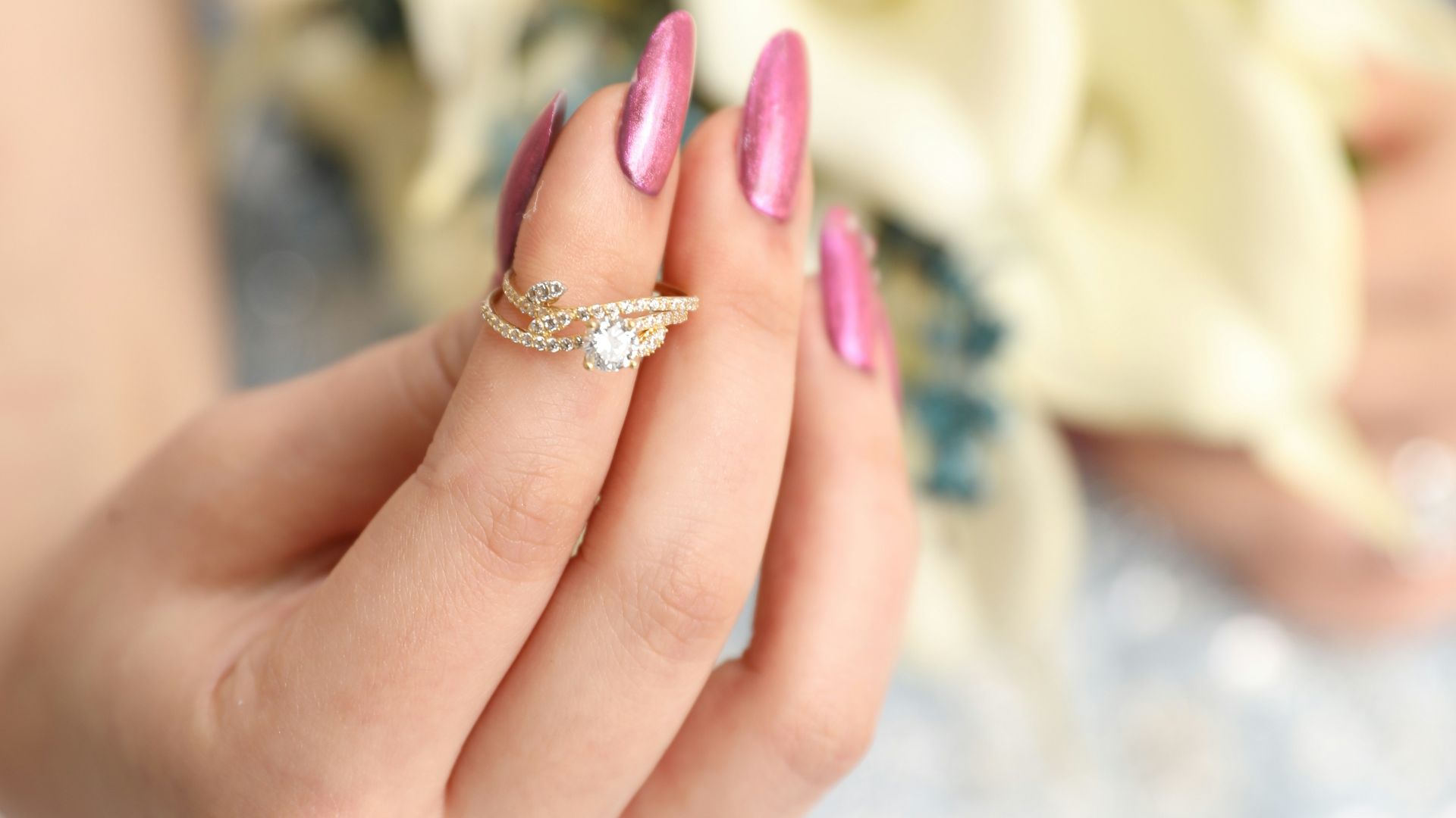 a woman in a wedding dress holding a bouquet of flowers