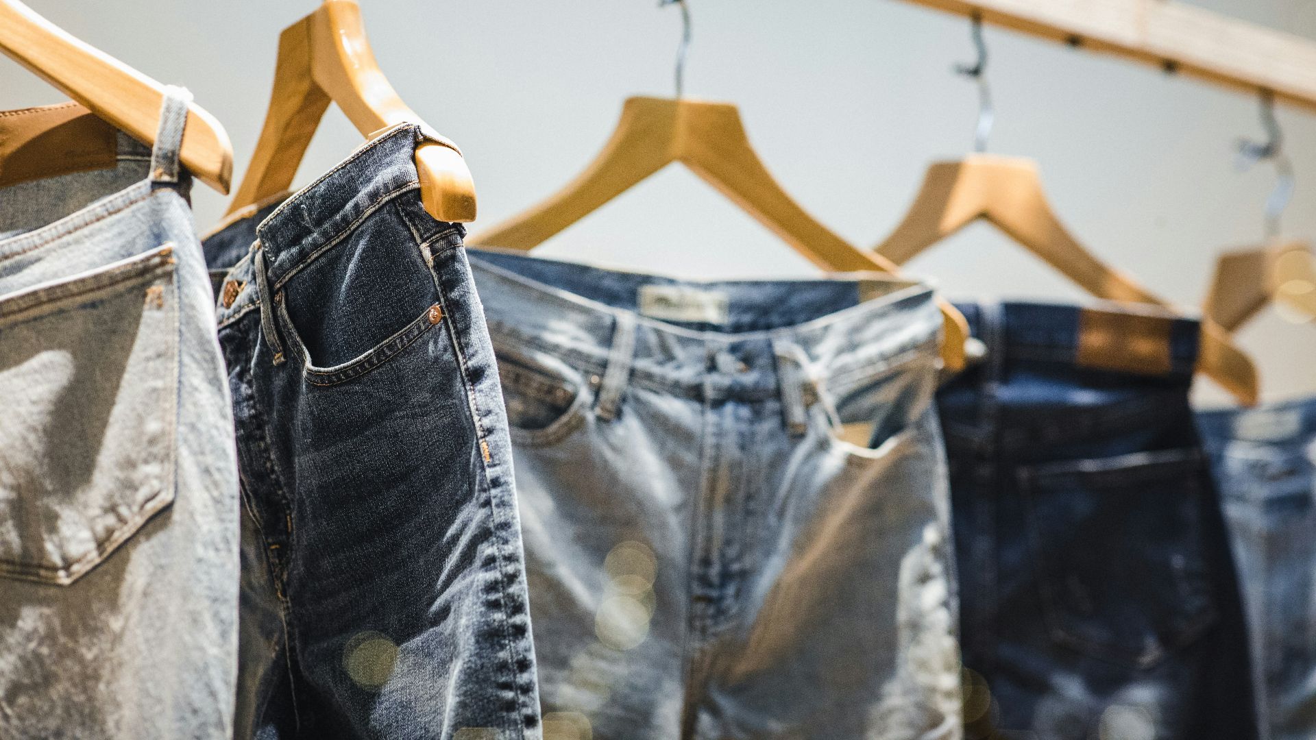 selective focus photography of hanged denim jeans