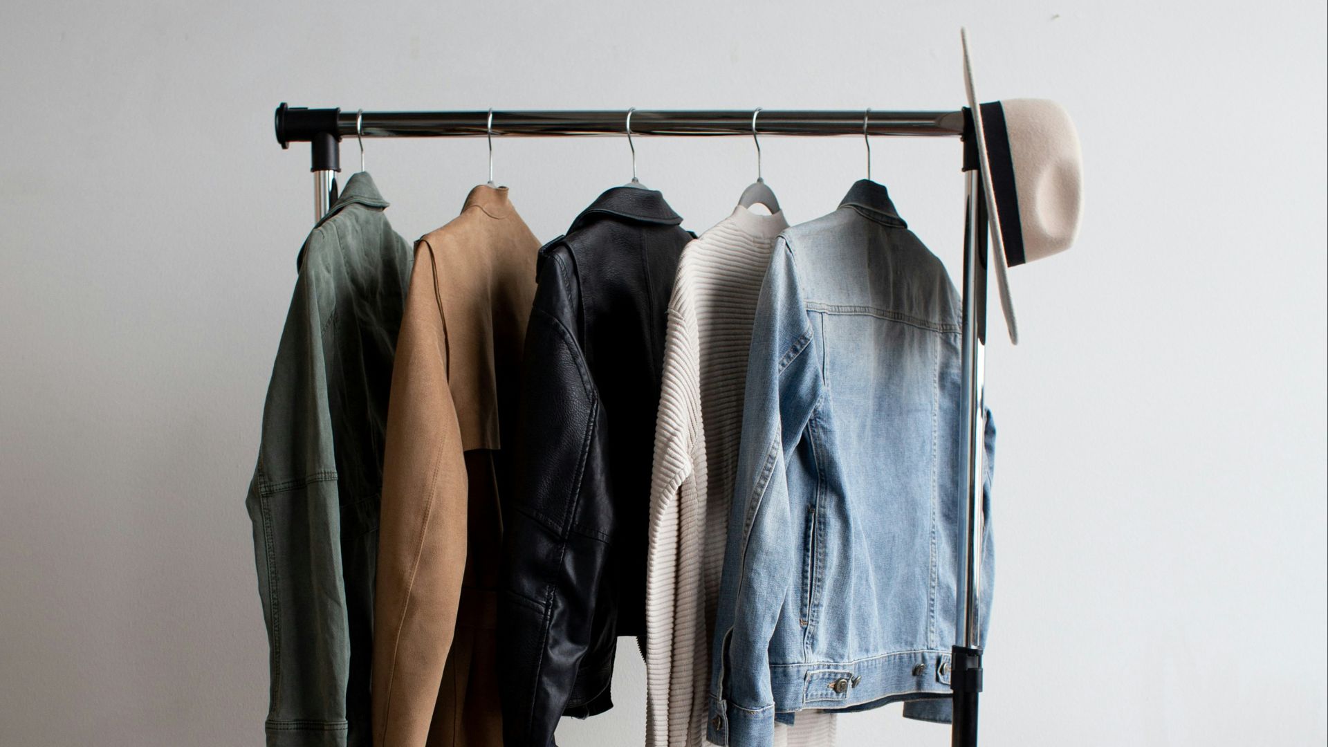 five jackets on clothes rack