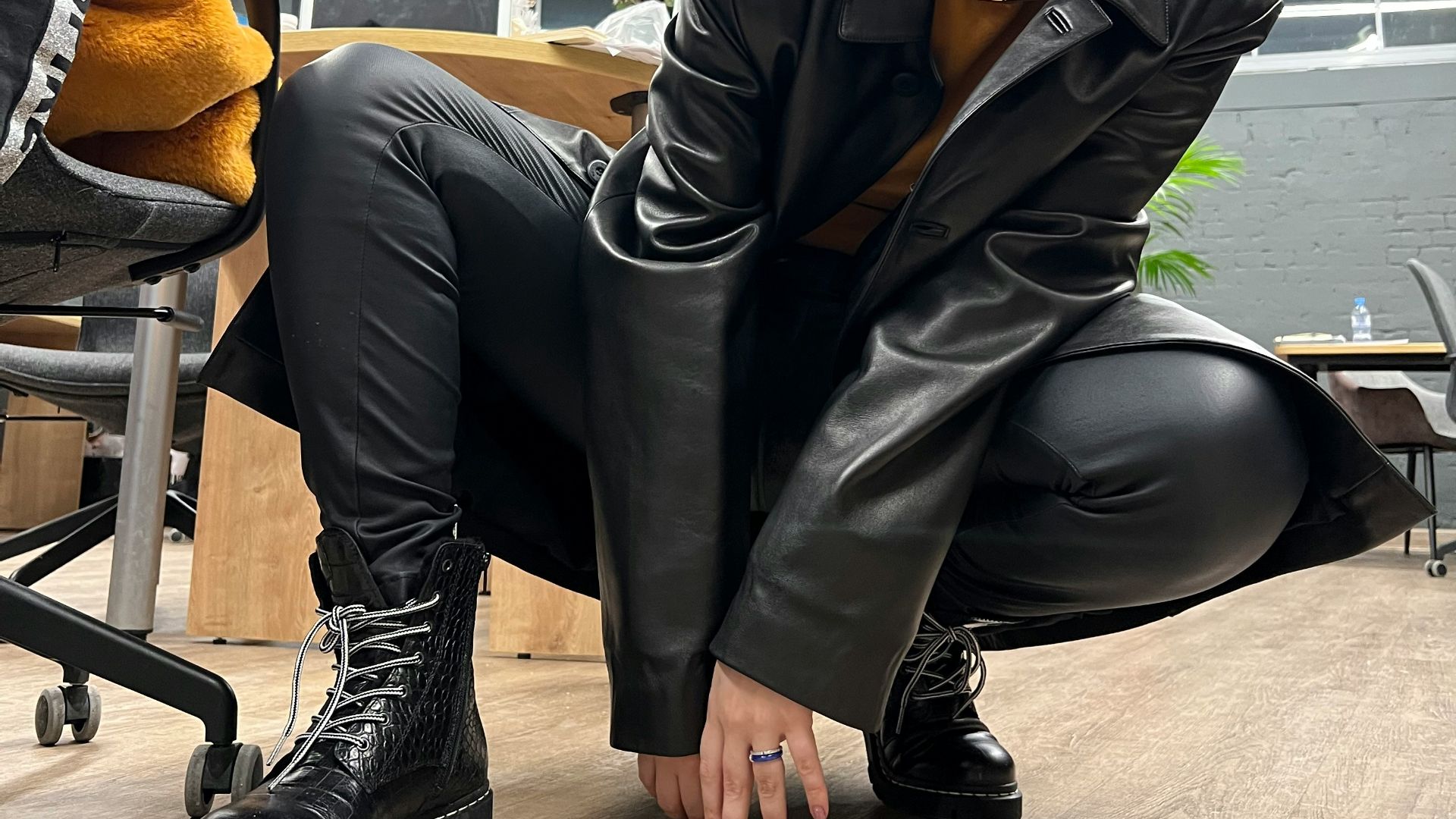 a woman sitting on the floor in a room