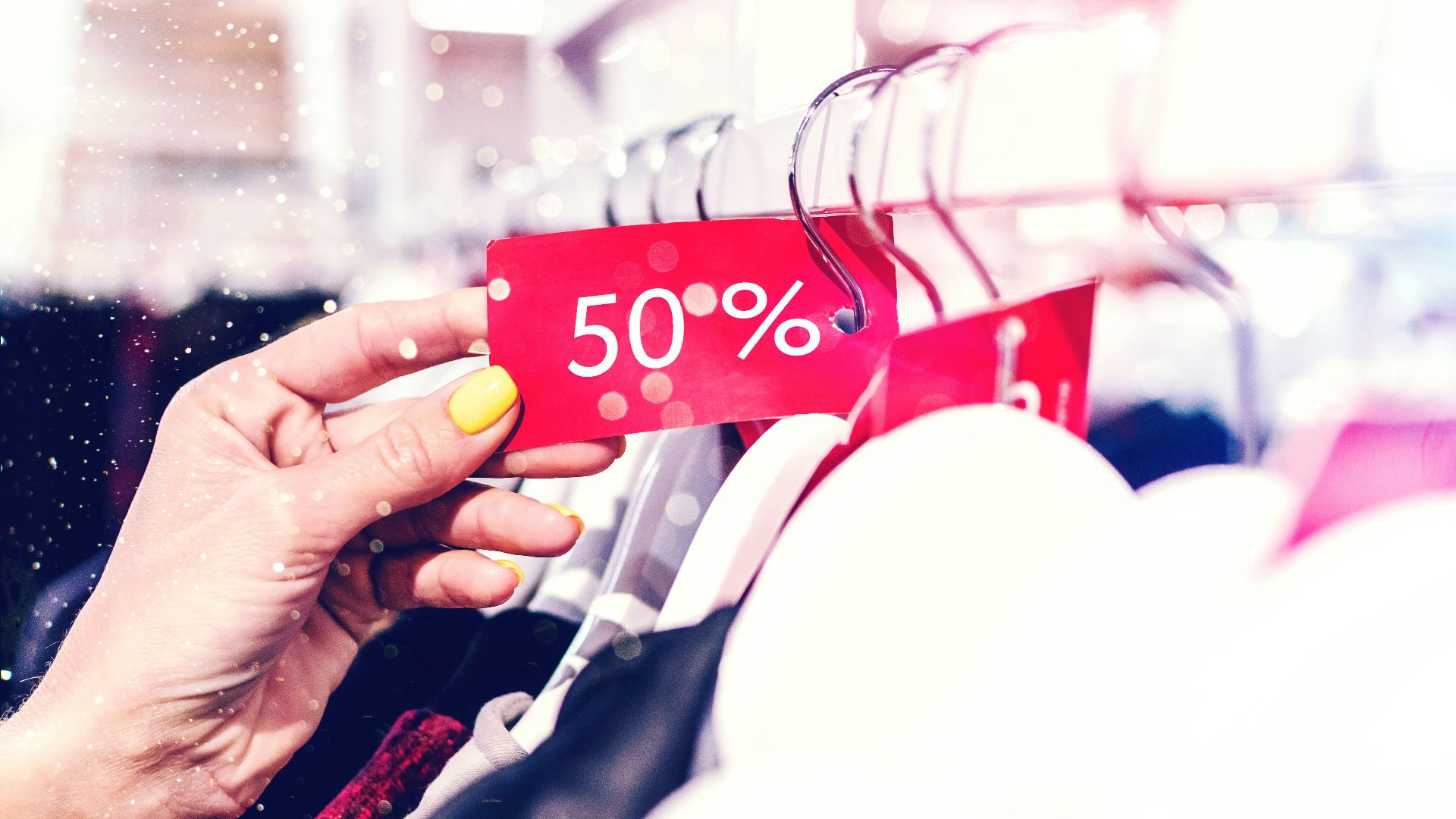 person holding red and white love print gift wrapper