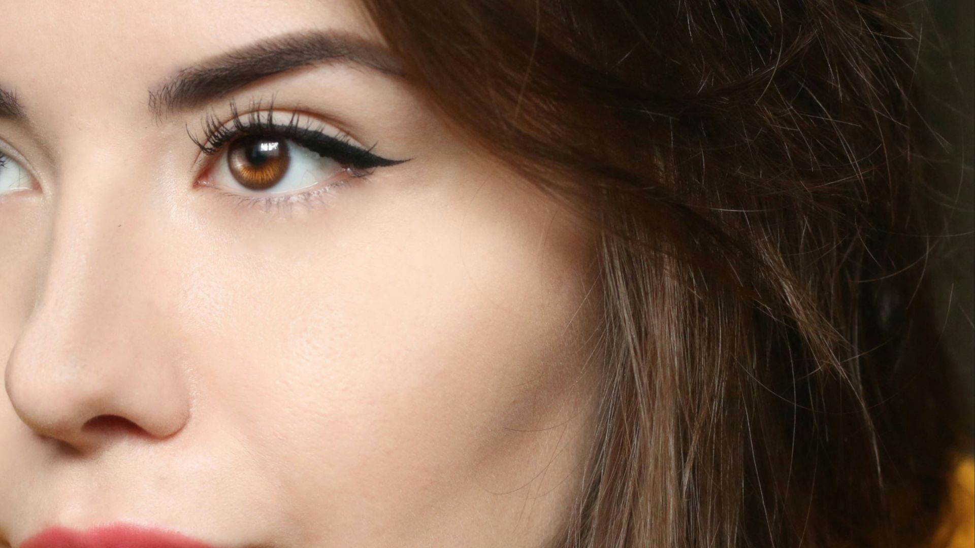 a close up of a person wearing a yellow shirt