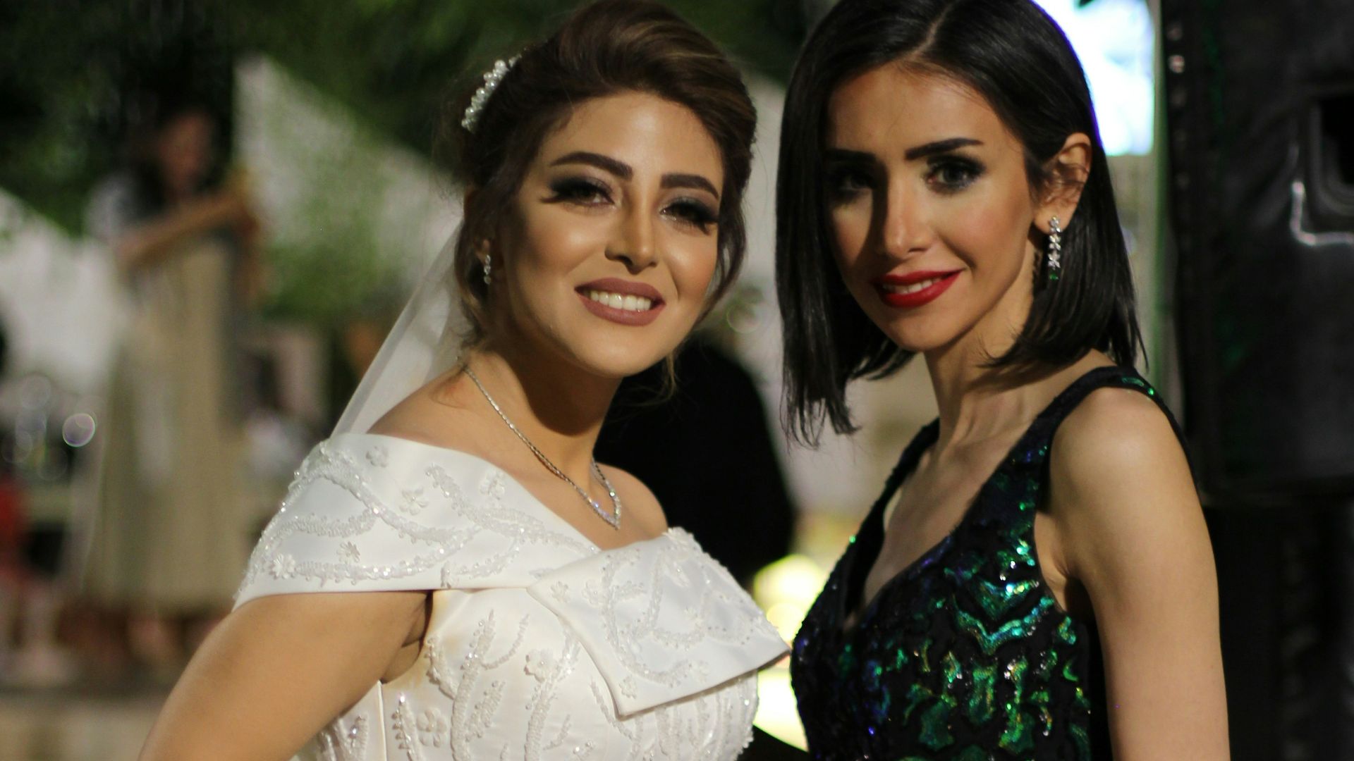 a couple of women standing next to each other