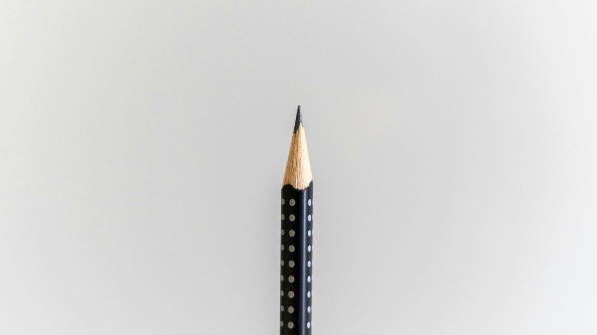 black pencil on white surface