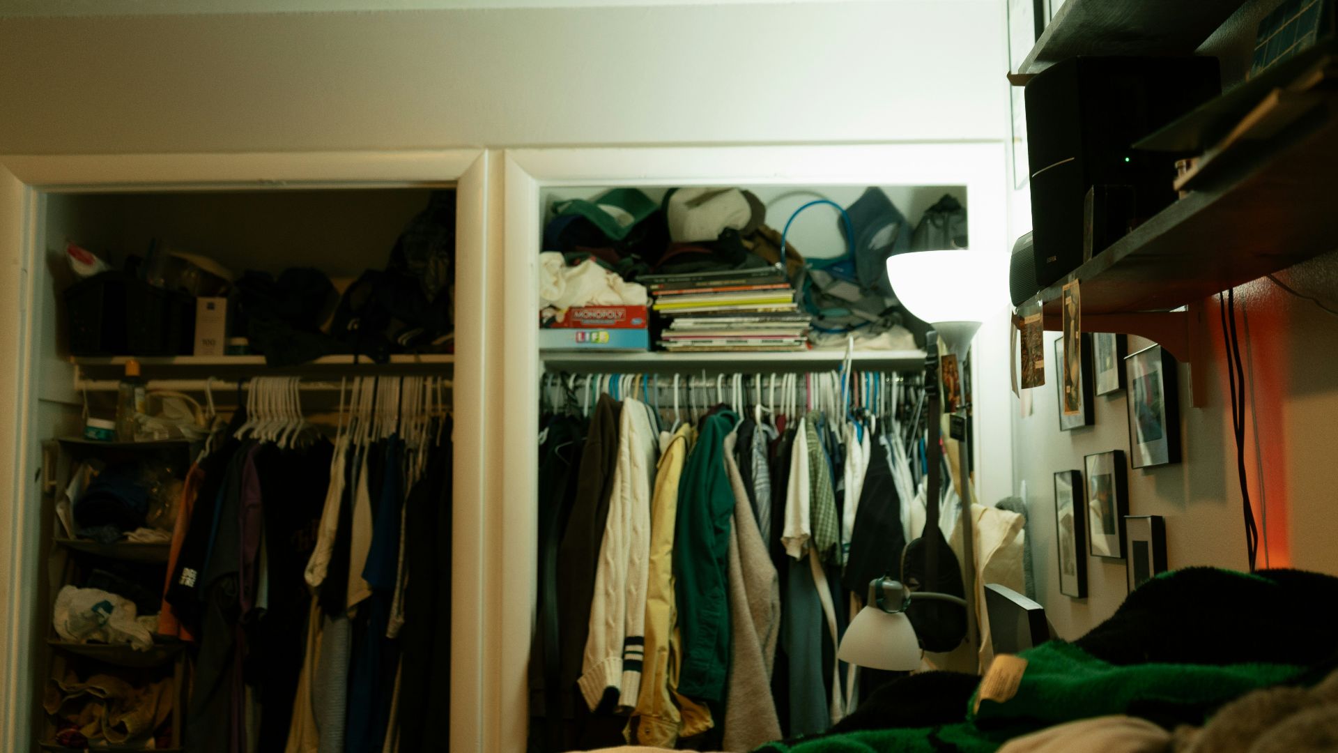 Closets overflowing with clothes and other items.