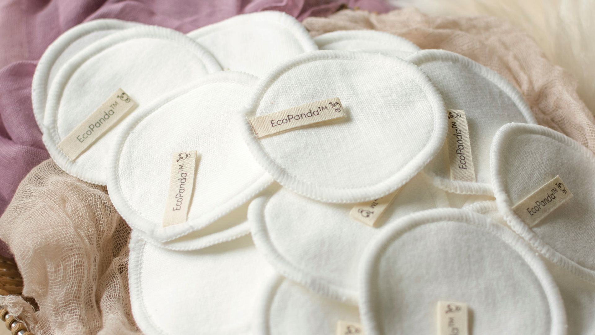 white and brown textile on purple textile