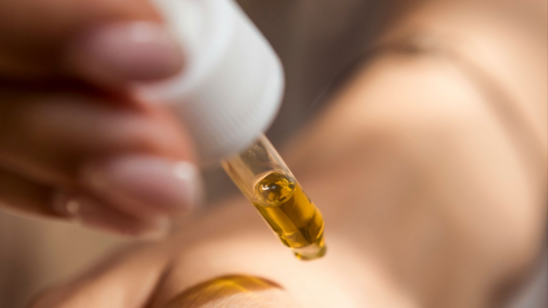 person holding dropper