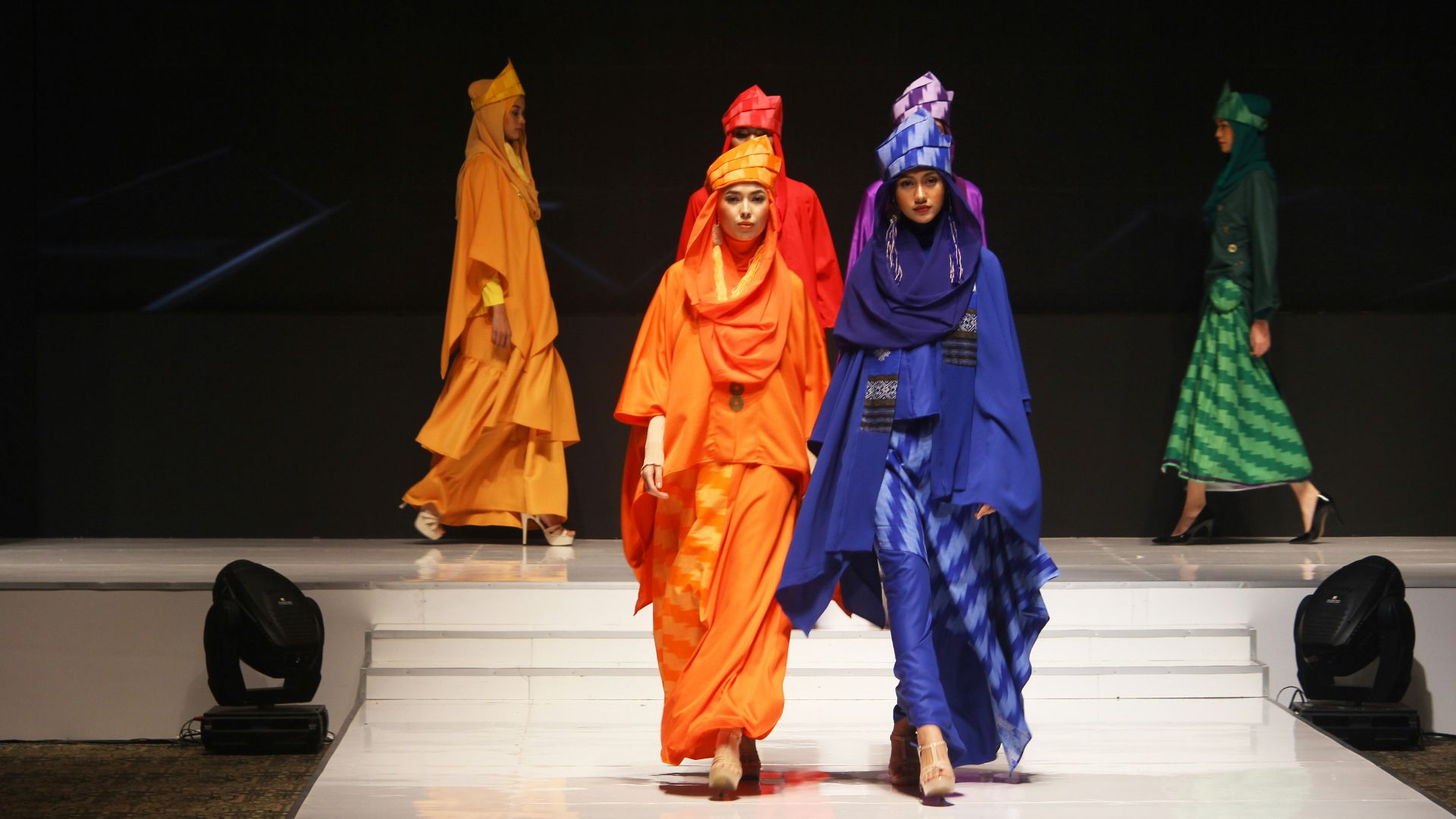 woman wearing dresses walking on catwalk