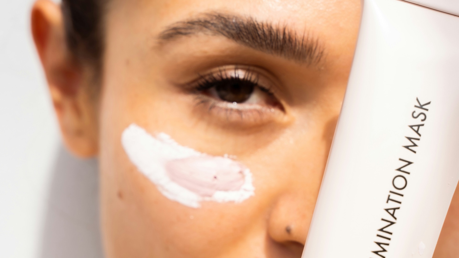 woman with white cream on face