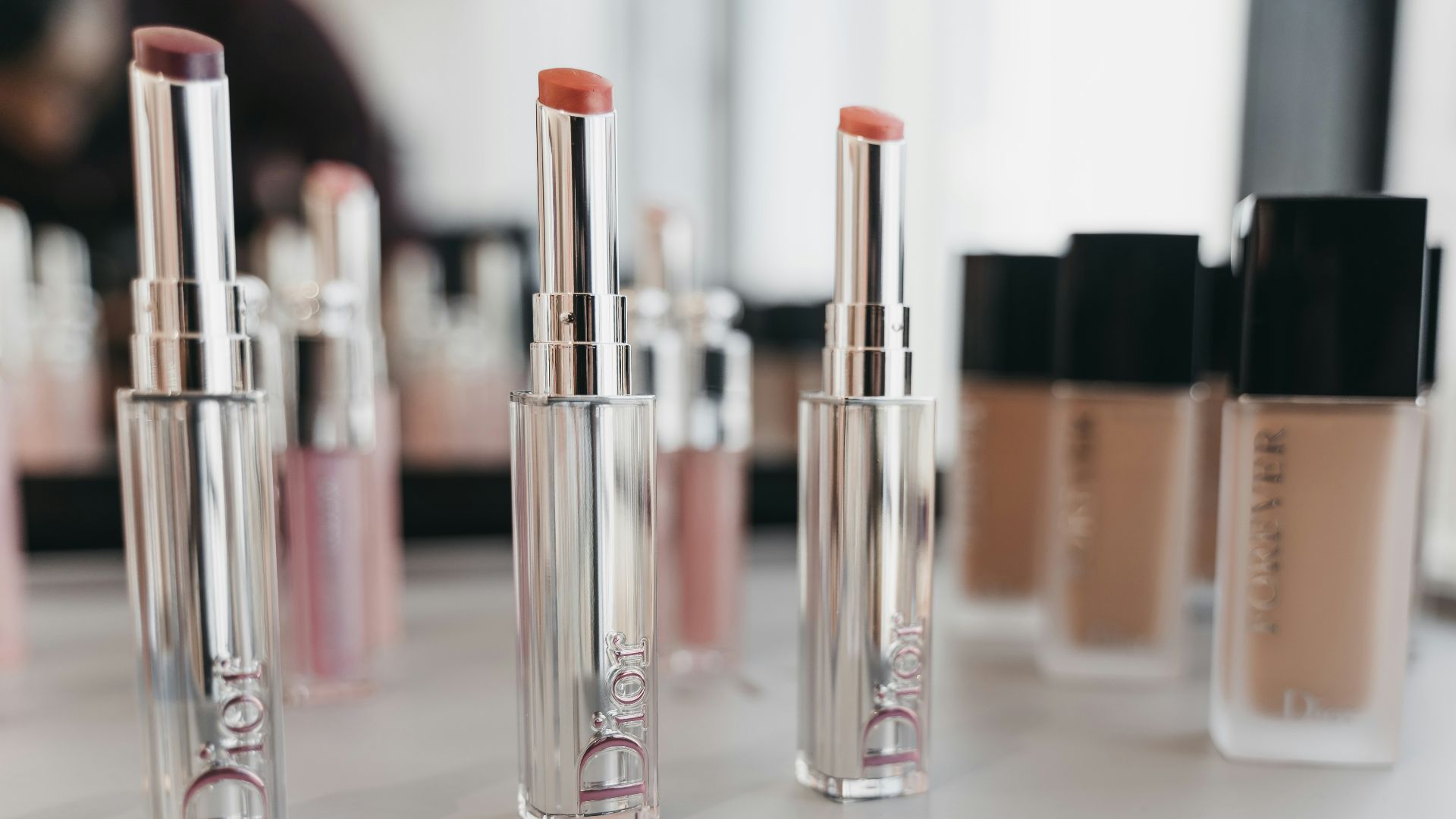 pink and silver nail polish bottles