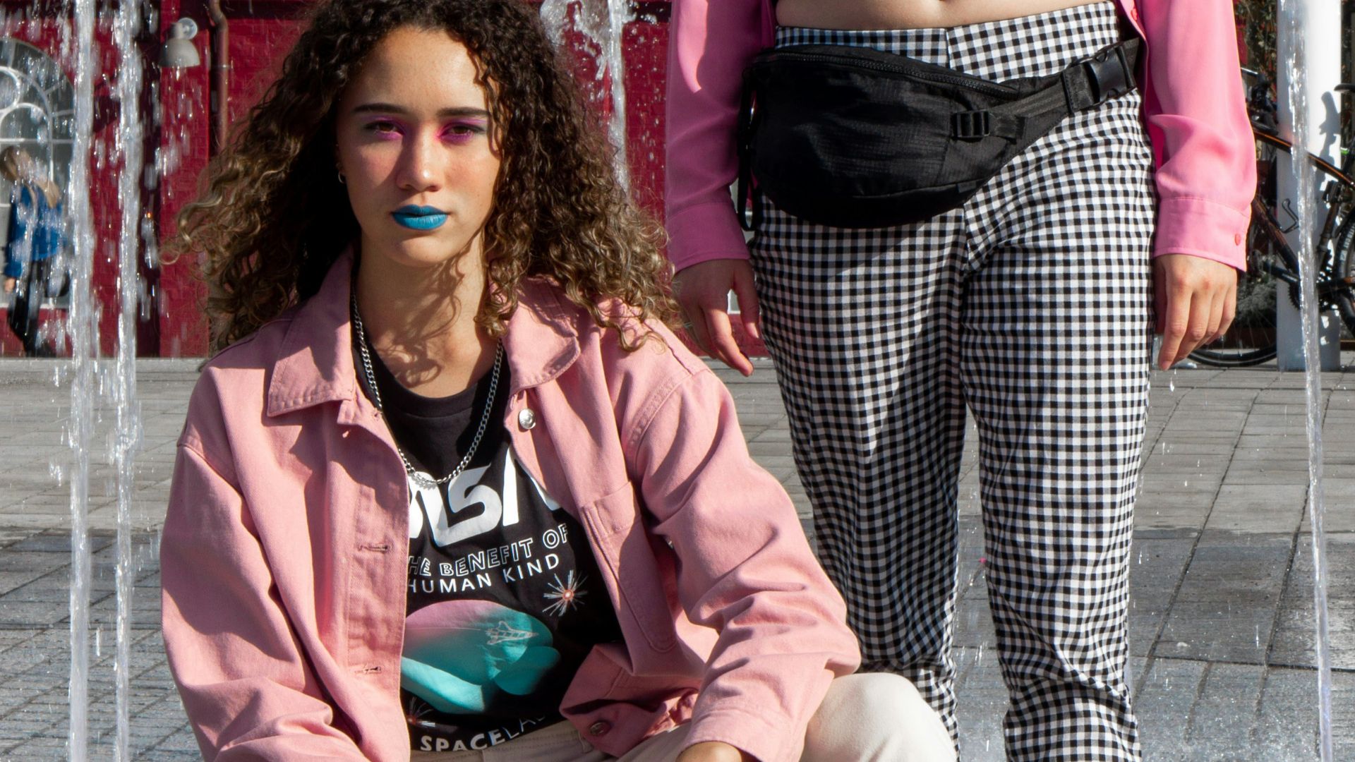 woman in pink jacket sitting beside woman in pink jacket